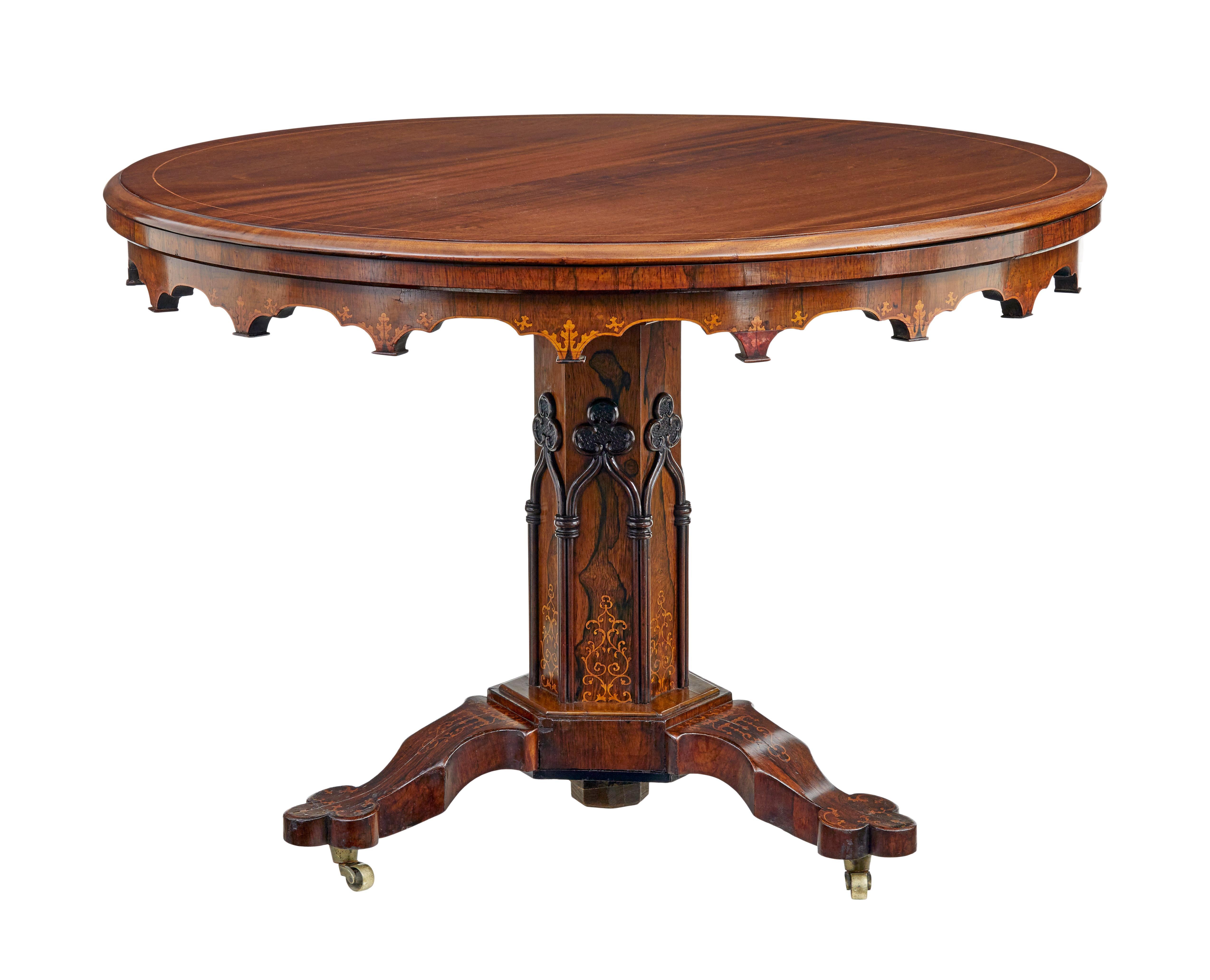 19th century french inlaid mahogany center table circa 1880.

Good quality ecclesiastical influenced center table.  Circular mahogany top with satinwood strung border.  Inlaid detail around the shaped freize.  Top supported by an hexagonal shaped