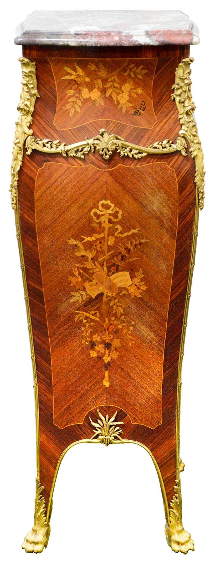 A fine quality late 19th Century Breche Violette marble top, bombe shaped pedestal, with wonderful scrolling foliate gilded ormolu mounts, Marquetry inlaid classical decoration to the front, depicting a tambourine, bows, ribbons, flowers and