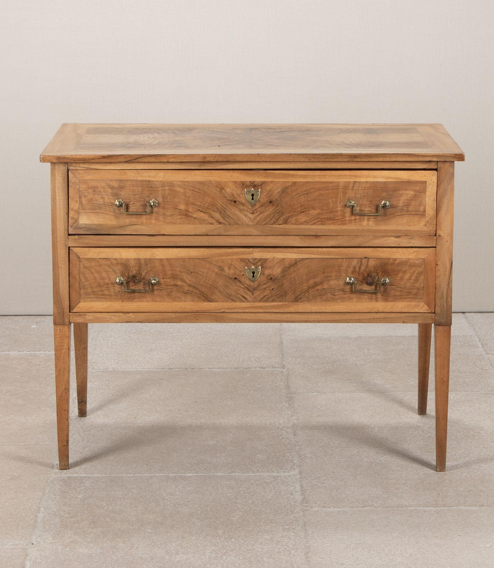 Late 19th Century French inlaid walnut commode. Comprising of two drawers on tapering legs. Circa 1880.