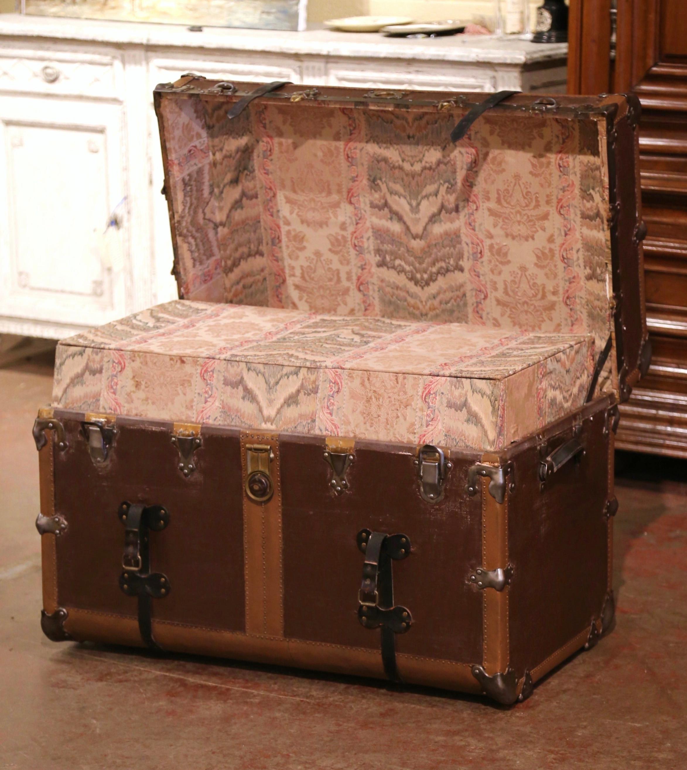 This large trunk would make an elegant coffee or cocktail table! Crafted in France circa 1890, the antique luggage is rectangular in shape, and finished on all five sides including the top; it features heavy leather side handles, decorative metal