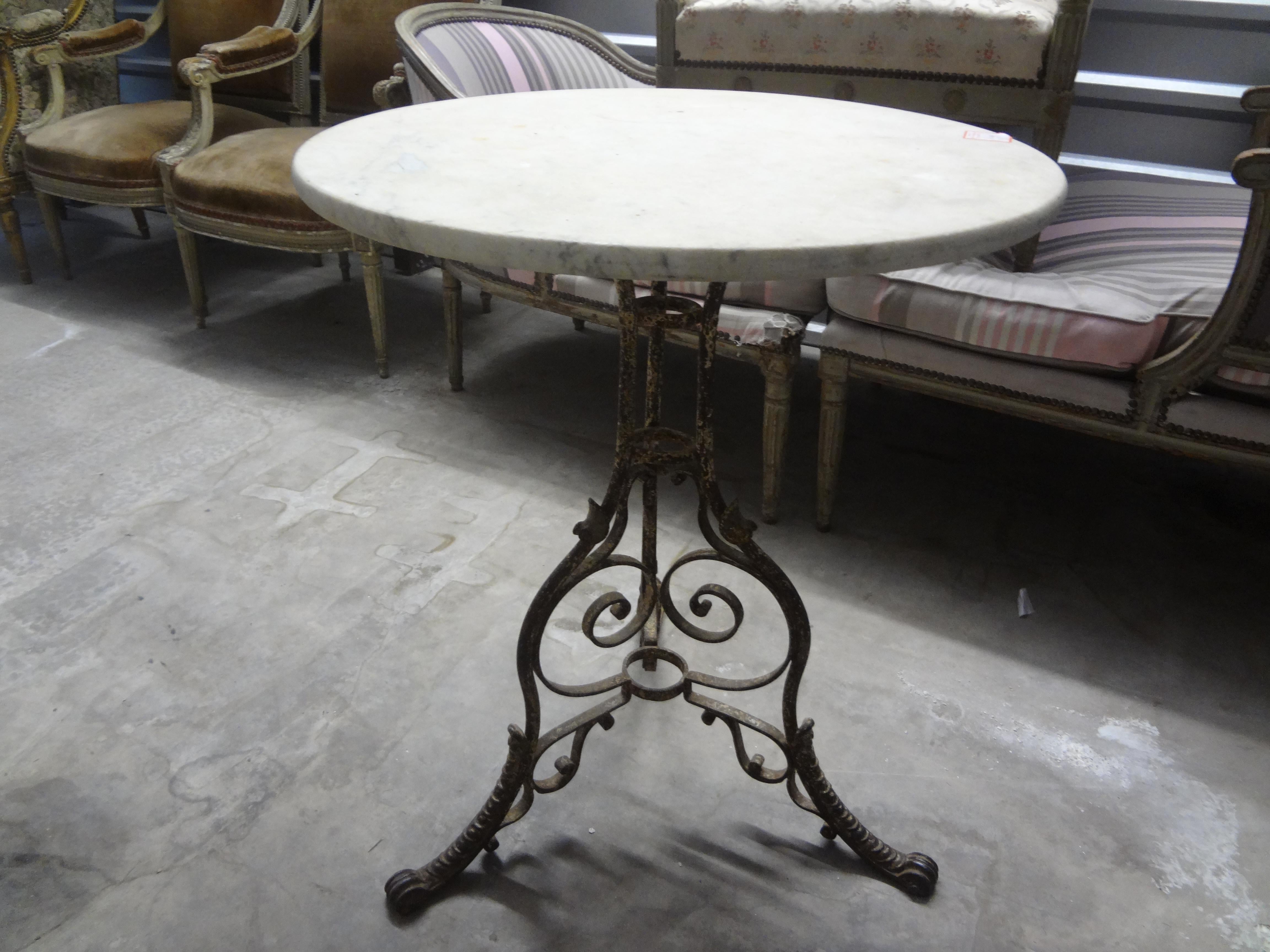 19th Century French Iron And Marble Garden Table.
Offered is a charming antique French iron garden table or bistro table with a Carrara marble top.
This beautiful table will work in outdoors in a garden setting or in many rooms indoors.
Great chippy