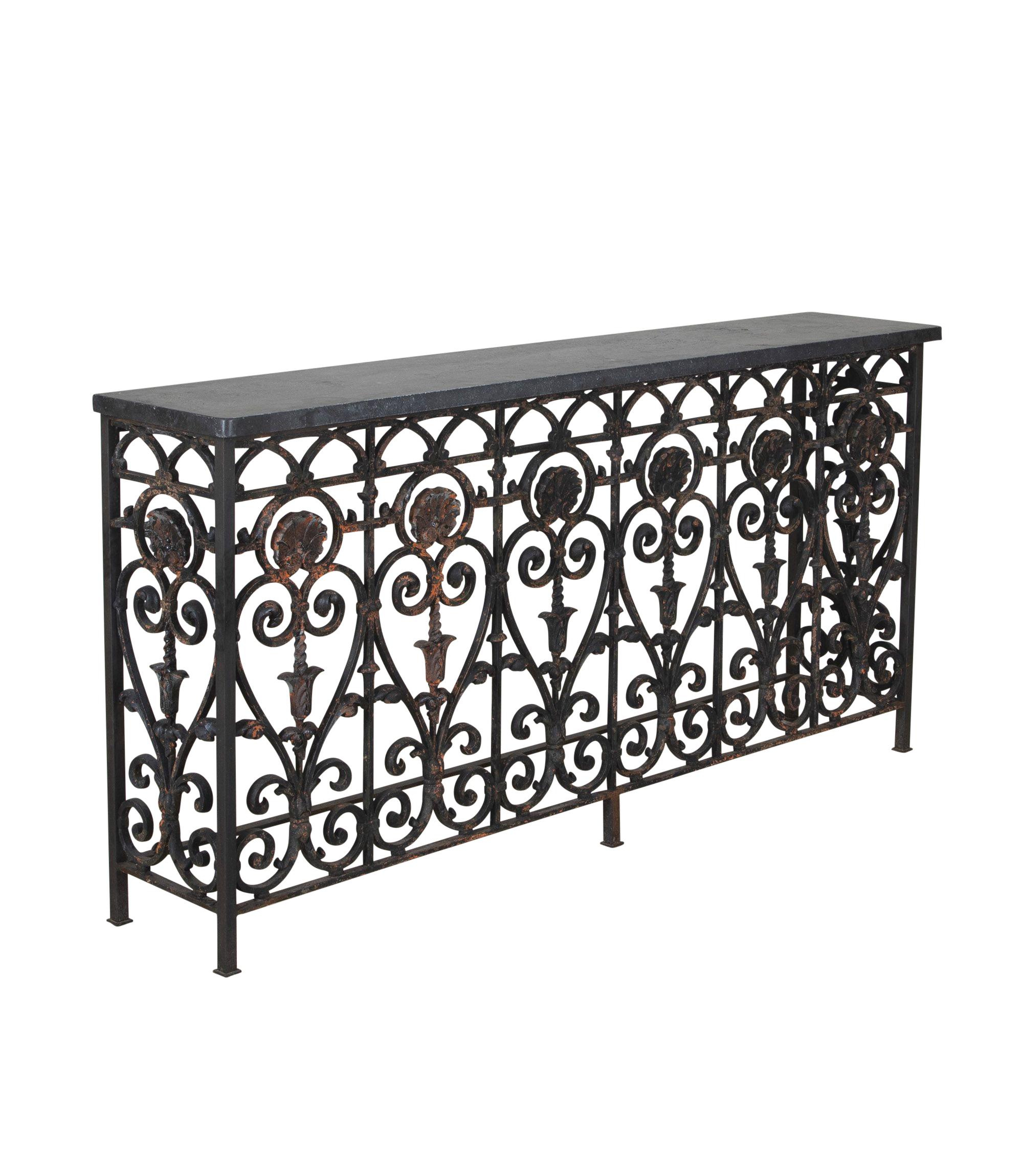 19th Century French cast iron balcony.
Excellent workmanship, with scroll and shell design and a time worn patina. Belgium blue slate top, ideal narrow consoles for a hallway, landing or over a radiator.
One of two consoles available, priced