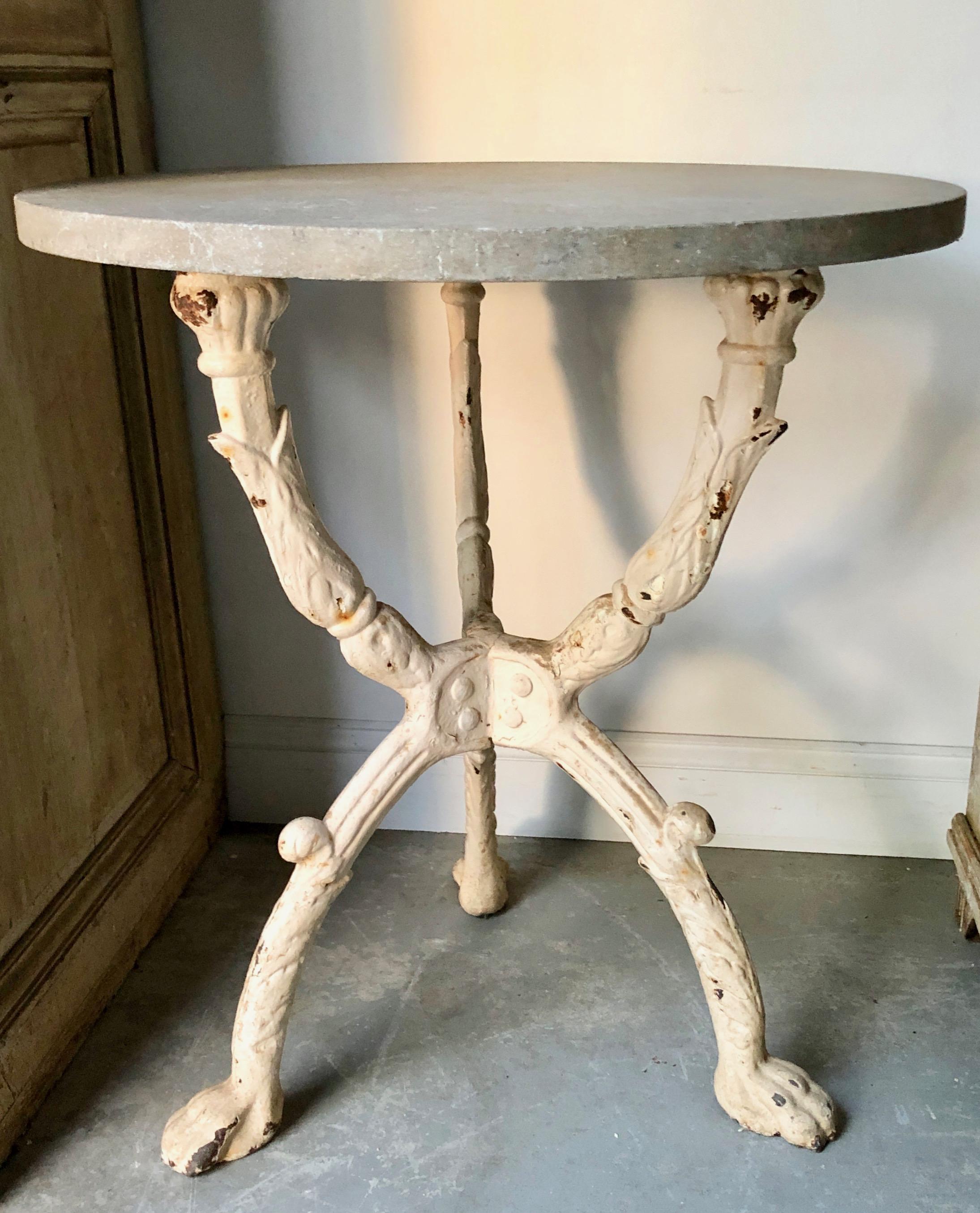 Nicely weathered 19th century French iron Bistro table with round stone top.
 