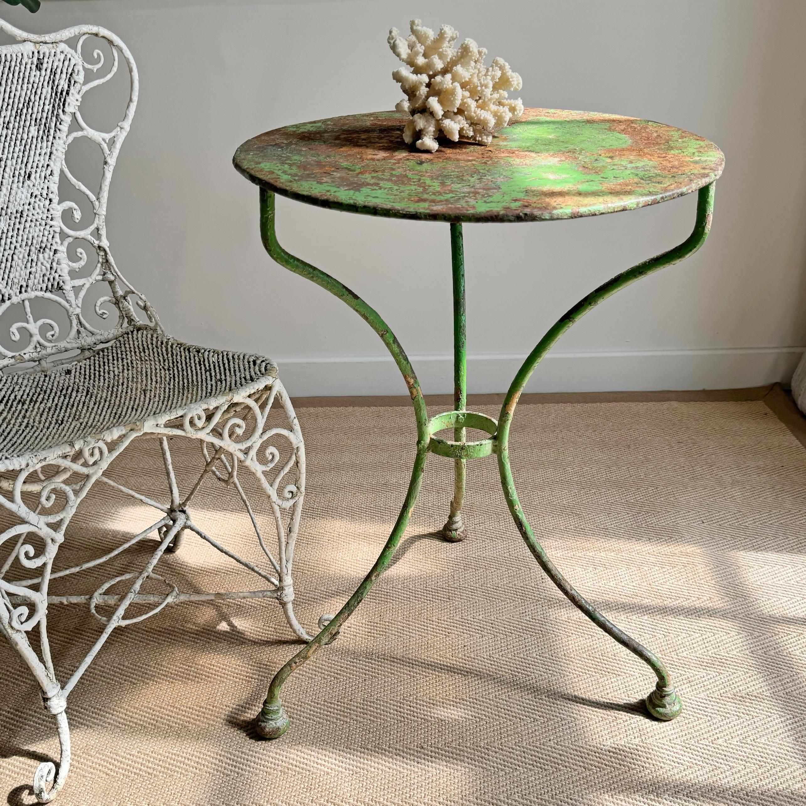A very pretty French cafe table, hand made in iron and dating to the end of the 1800's, beautiful green paint, with losses to the paint in some areas, a very usable size, with very unusual ball feet.



Height 69 cm x 50.5 cm Width

Feet are 54 cm