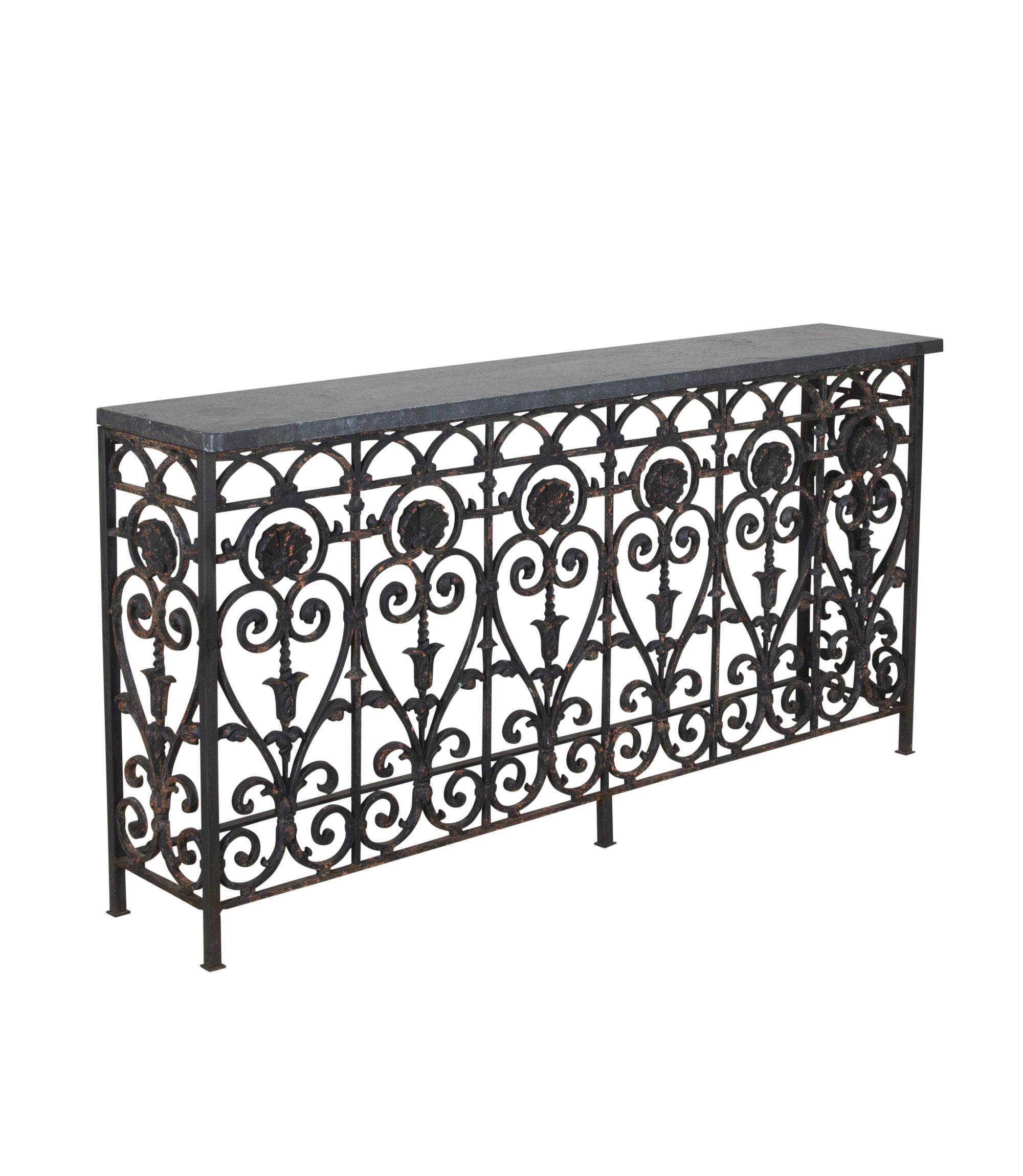 19th Century French cast iron balcony.
Excellent workmanship, with scroll and shell design and a time worn patina. Belgium blue slate top, ideal narrow consoles for a hallway, landing or over a radiator.
One of two consoles available, priced