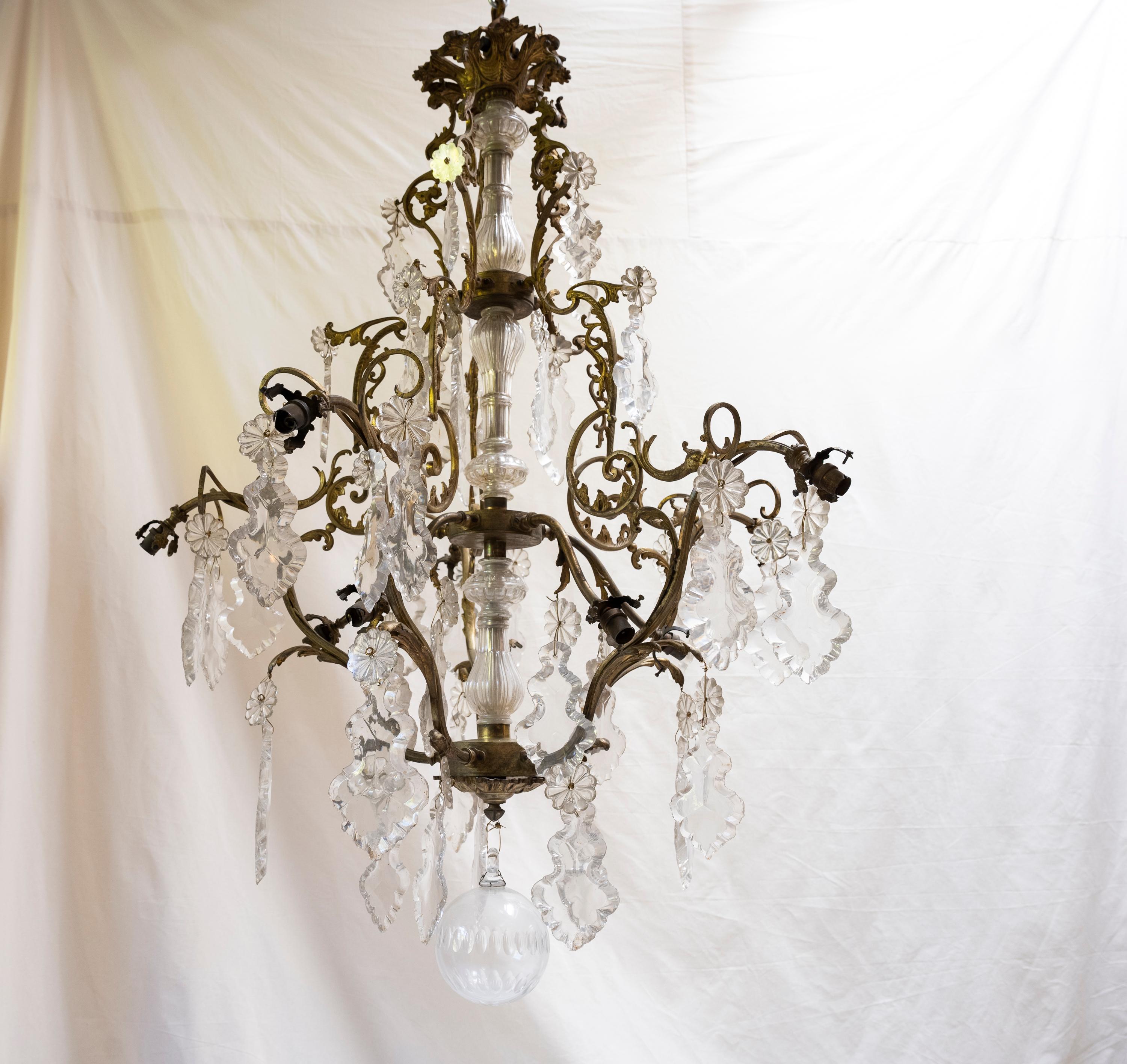 Large and incredibly gorgeous, this chandelier hung prominently in a dining room of a family’s chateau.
There are several chips on many of the crystal pendants, and the original bulb covers are missing.
Can be used decoratively, or can be rewired
