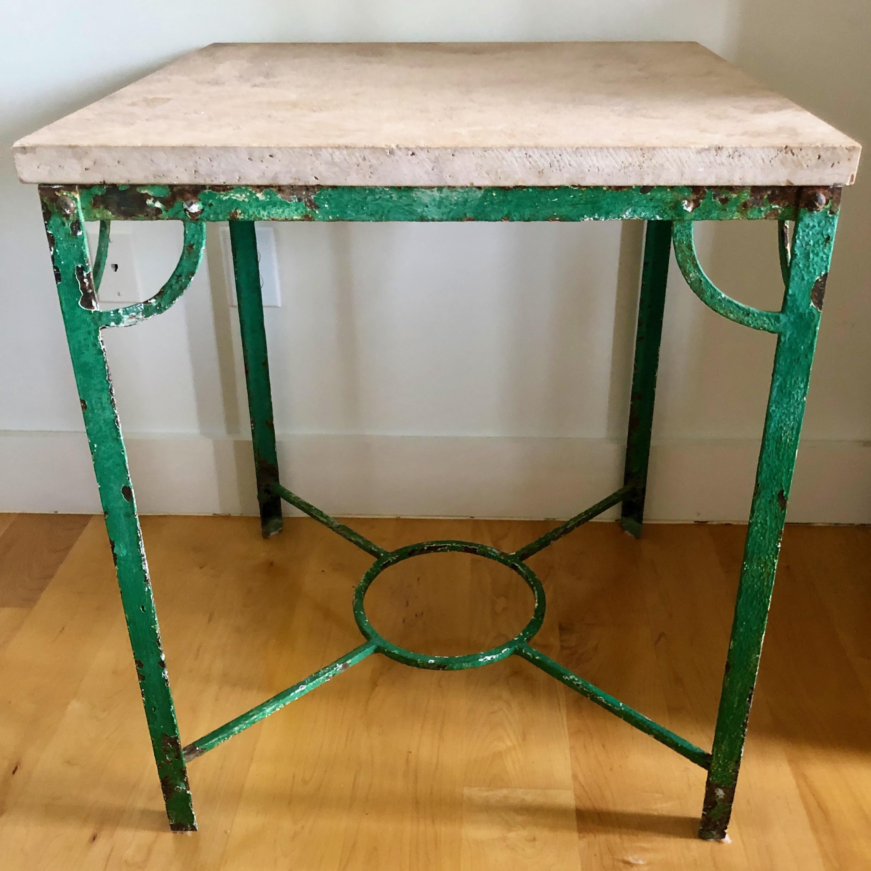 Handsome French iron table with stone top in original bright green patina.
Outside or inside use with a lot of wear -lot of charm.