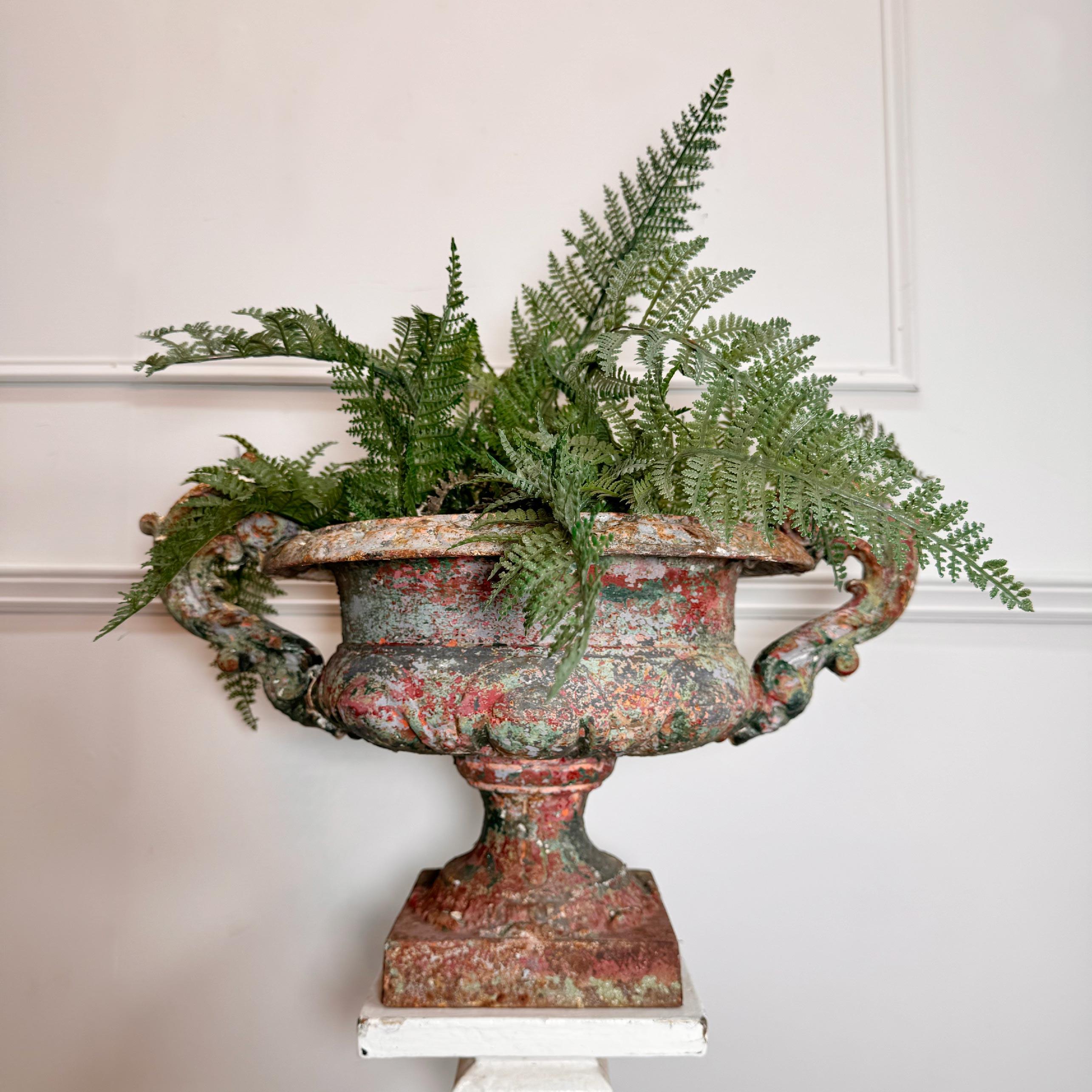 A truly stunning early 19th century French cast iron tazza urn, complete with the highly rare original interior water drainer, and in the most beguiling historic red and green paint colorway imaginable, an absolutely dazzling decorators piece that
