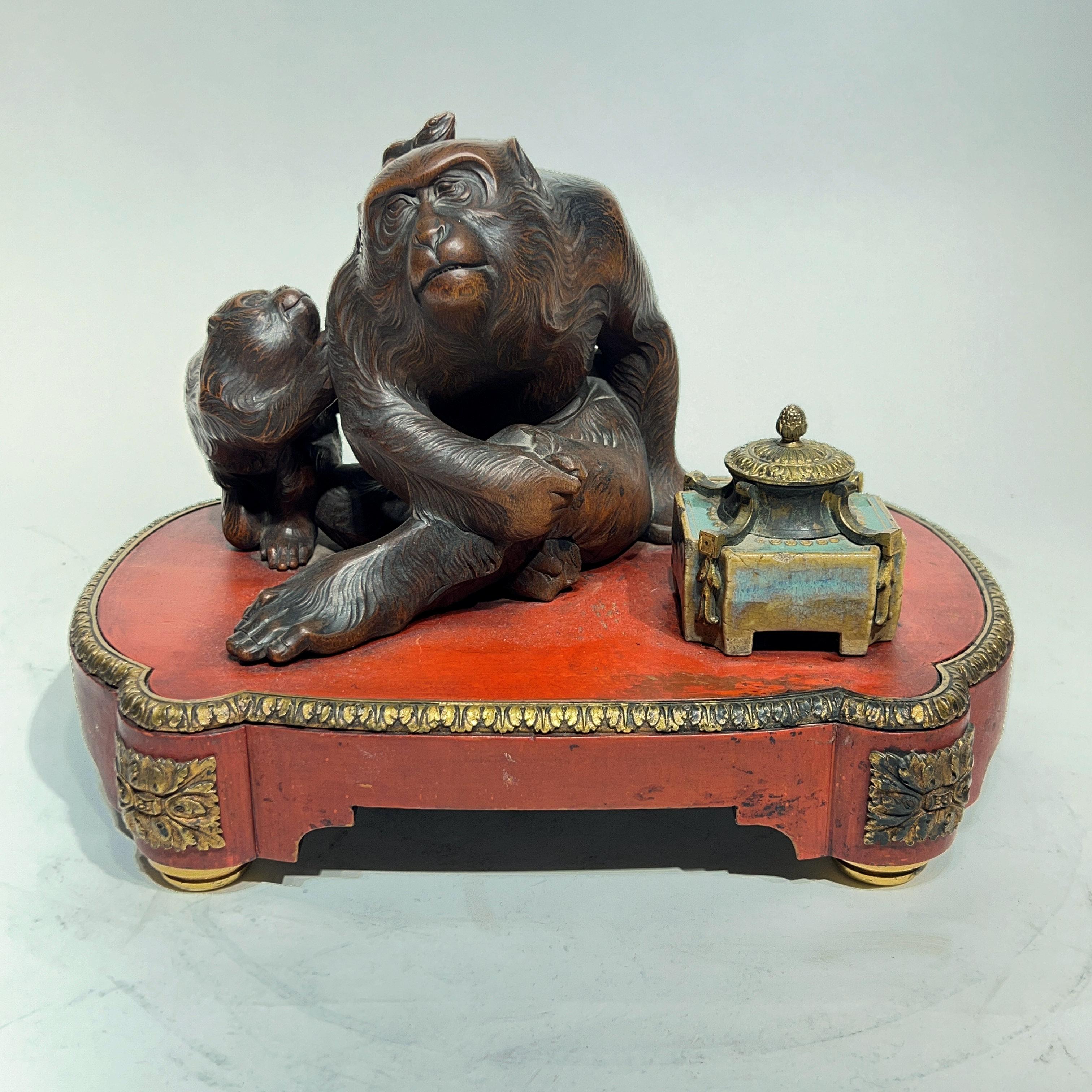 Antique French / Meiji Japanese inkwell featuring the finely carved figure of female and infant monkeys and well crafted from ceramic with glazed finish.