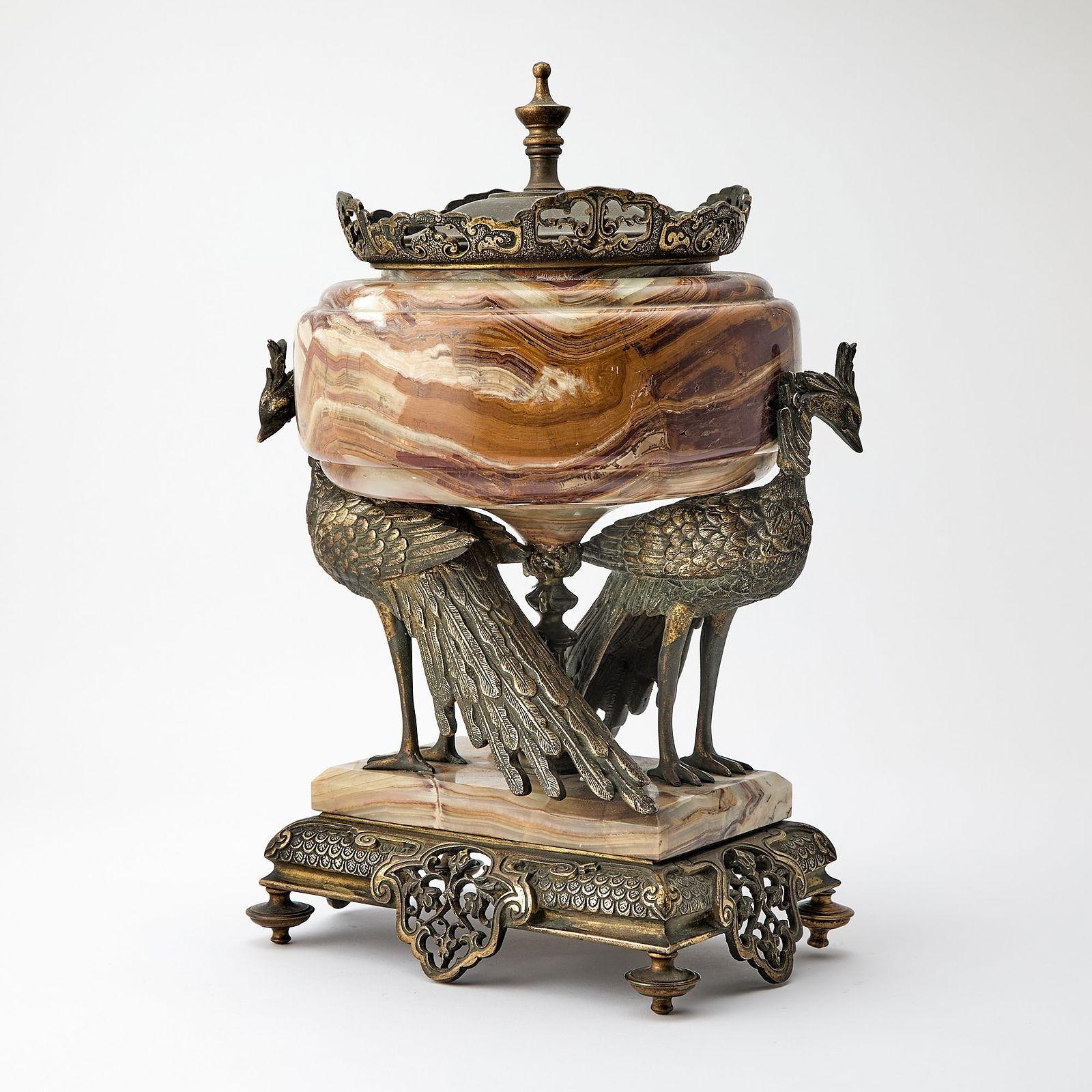 Antique French sculptural centerpiece crafted from onyx stone is mounted with pierced bronze base and peacocks from the Japonisme period, attributed to G. Viot et Cie of Paris, after the design by Eugene Cornu (1827-1899).  27 x 10 x 9 inches. 
