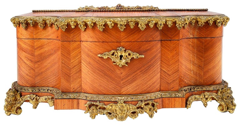 A good quality late 19th century Kingwood and gilded ormolu-mounted jewellery box, having a Sevres style porcelain plaque and silk lined interior.