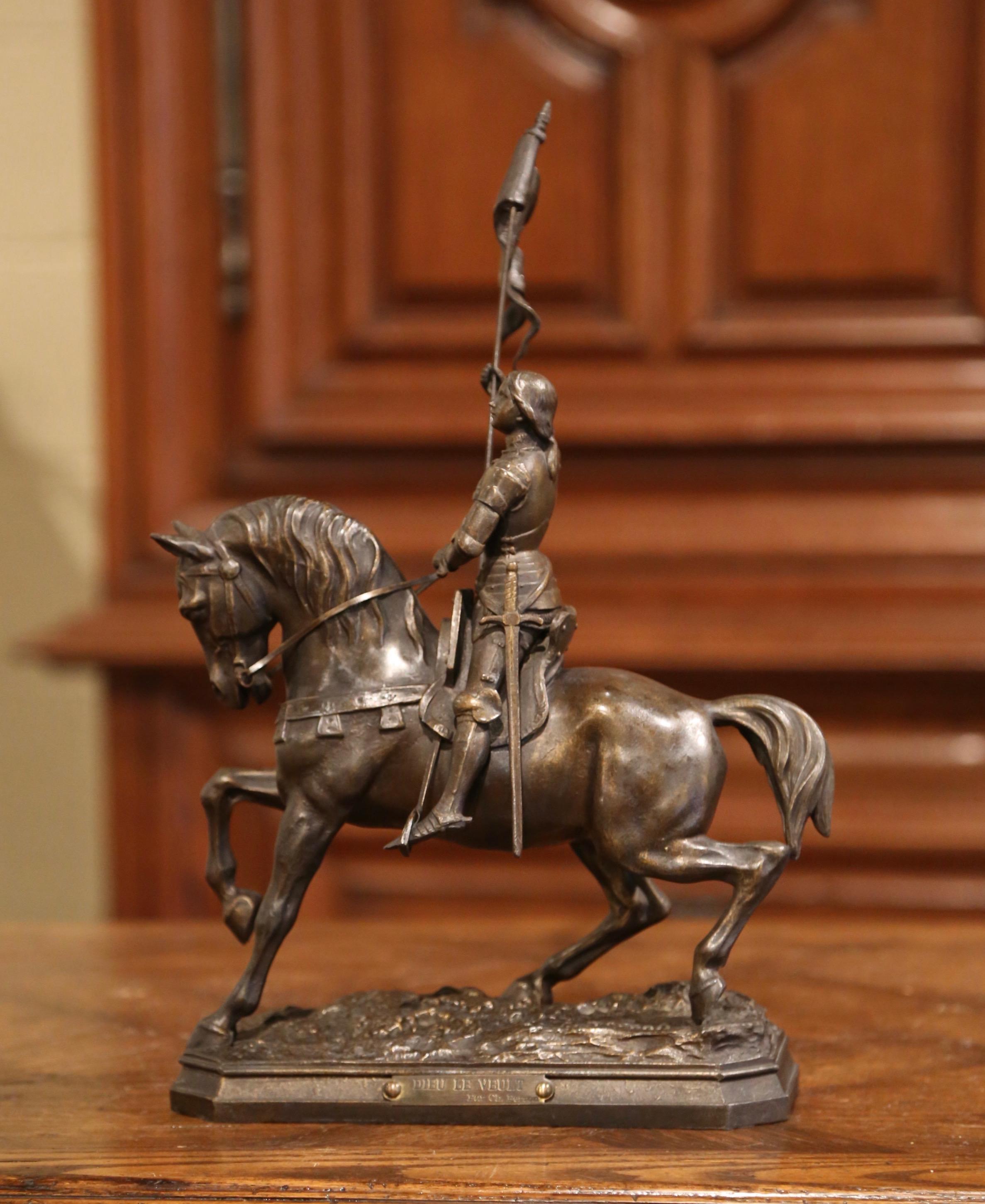 Crafted in France circa 1890, the antique figure depicts Sainte Jeanne d'Arc on her horse waving the victory flag after the battle of Orleans. The sculpture titled 