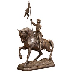 figurine française du 19ème siècle Jeanne d'Arc à cheval en fonte patinée signée Perron