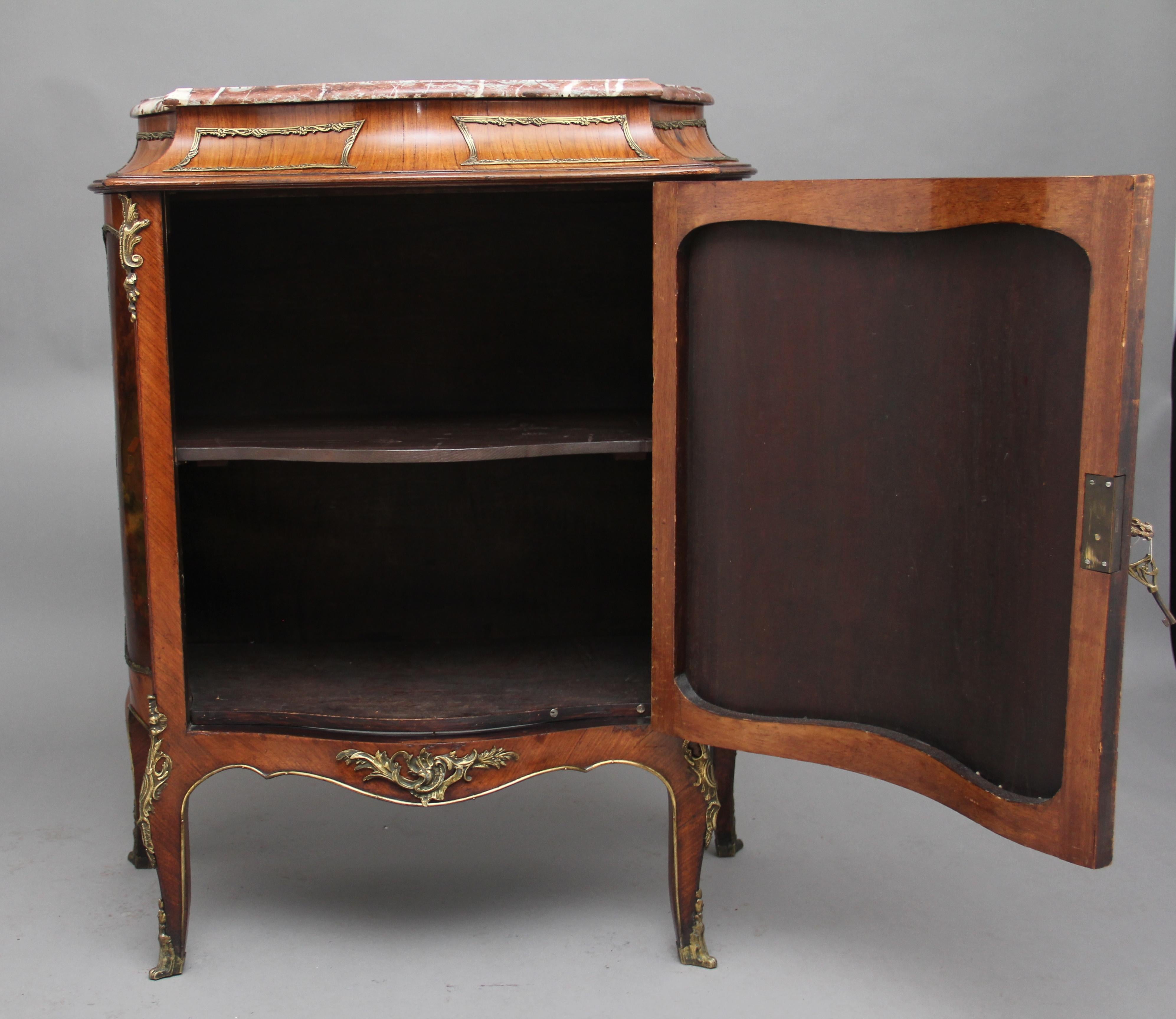 19th century French Kingwood and brass-mounted marble top cabinet, having the original red and white moulded edge and shaped marble top above a shaped frieze with lovely quality brass rectangular mouldings, the front and sides of the cabinet having