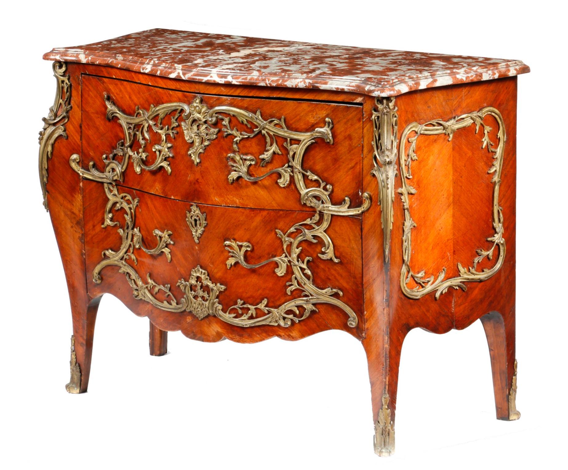 19th century French kingwood bombe commode with red marble top in Louis XV style, with scrolling leaf ormolu mounts, the serpentine marble top with a moulded edge, above two deep drawers and keeled angles.
France, circa 1860.
     