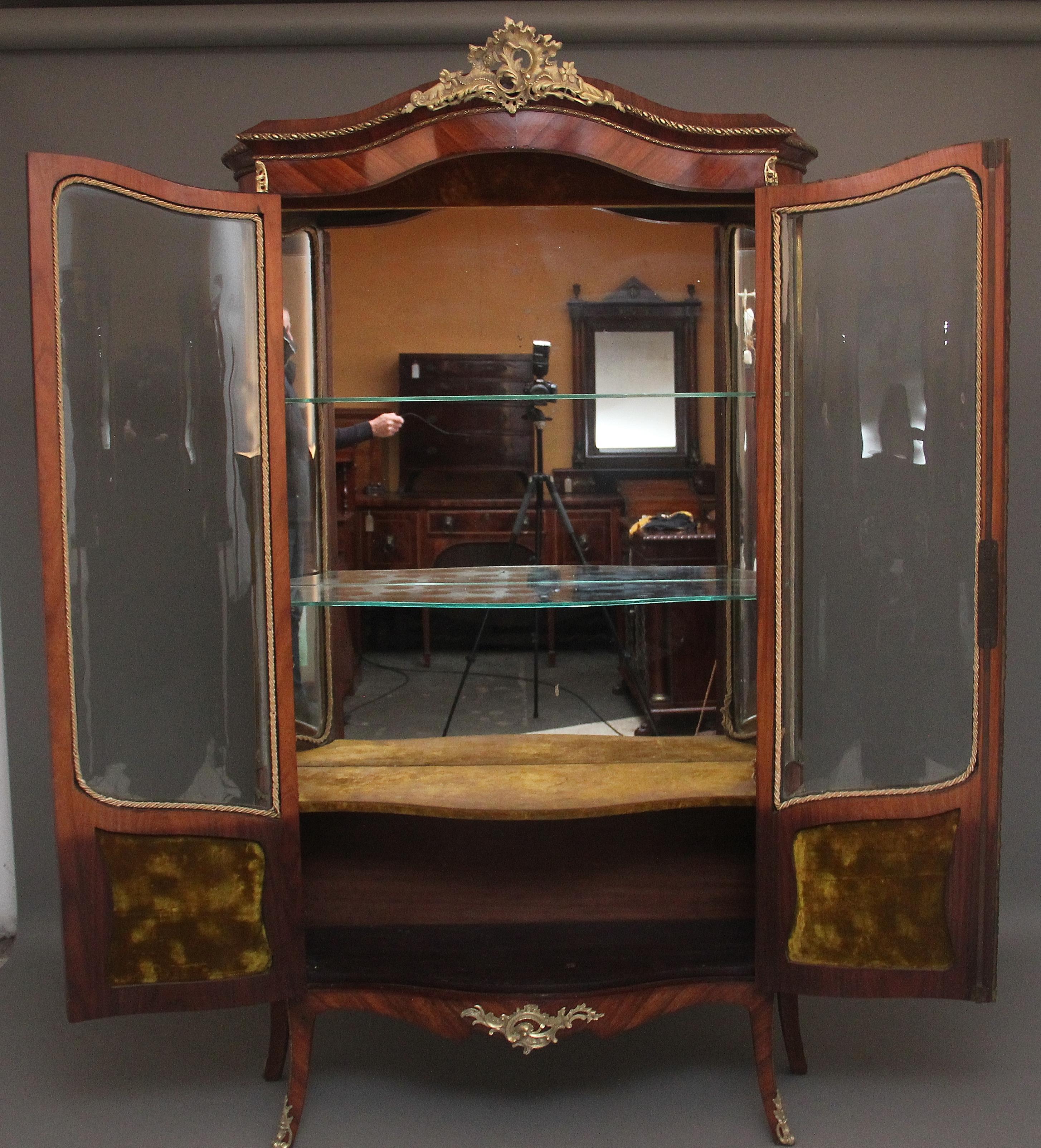 A fabulous quality 19th Century French Kingwood and ormolu mounted display cabinet / vitrine in the Louis XV style, the shaped top with ormolu beading along the edge and a highly decorative large floral ormolu mount at the centre above two shaped