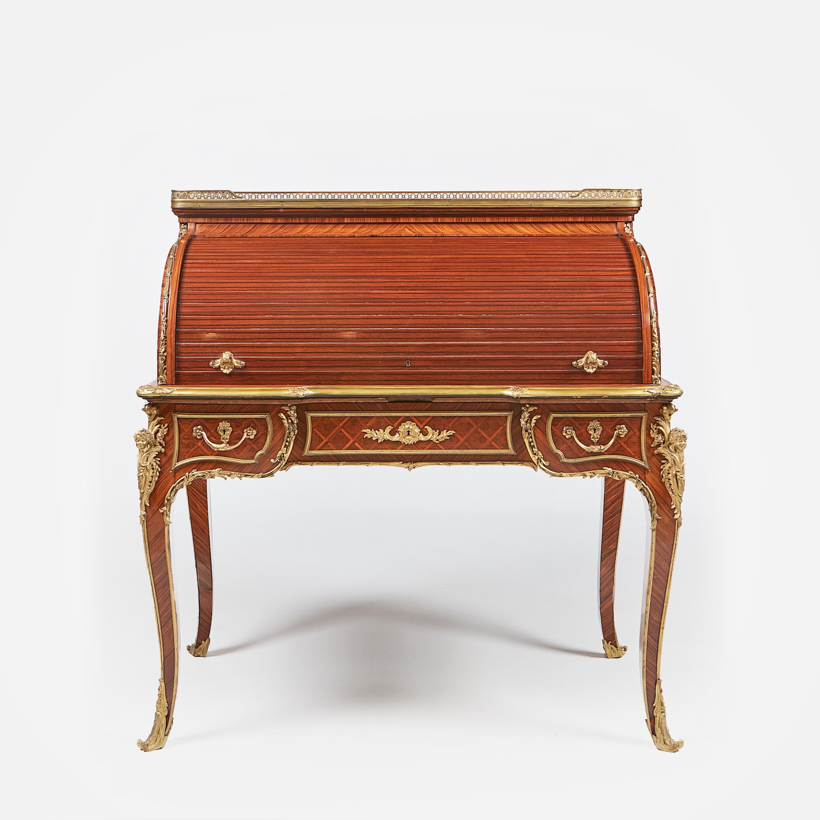 A stunning late 19th century kingwood, parquetry and ormolu mounted Louis XVI style Bureau à Cylindre attributed to Francoise Linke, the alabastro a pecorella marble top above a tambour enclosing an interior fitted with a shelf and four drawers