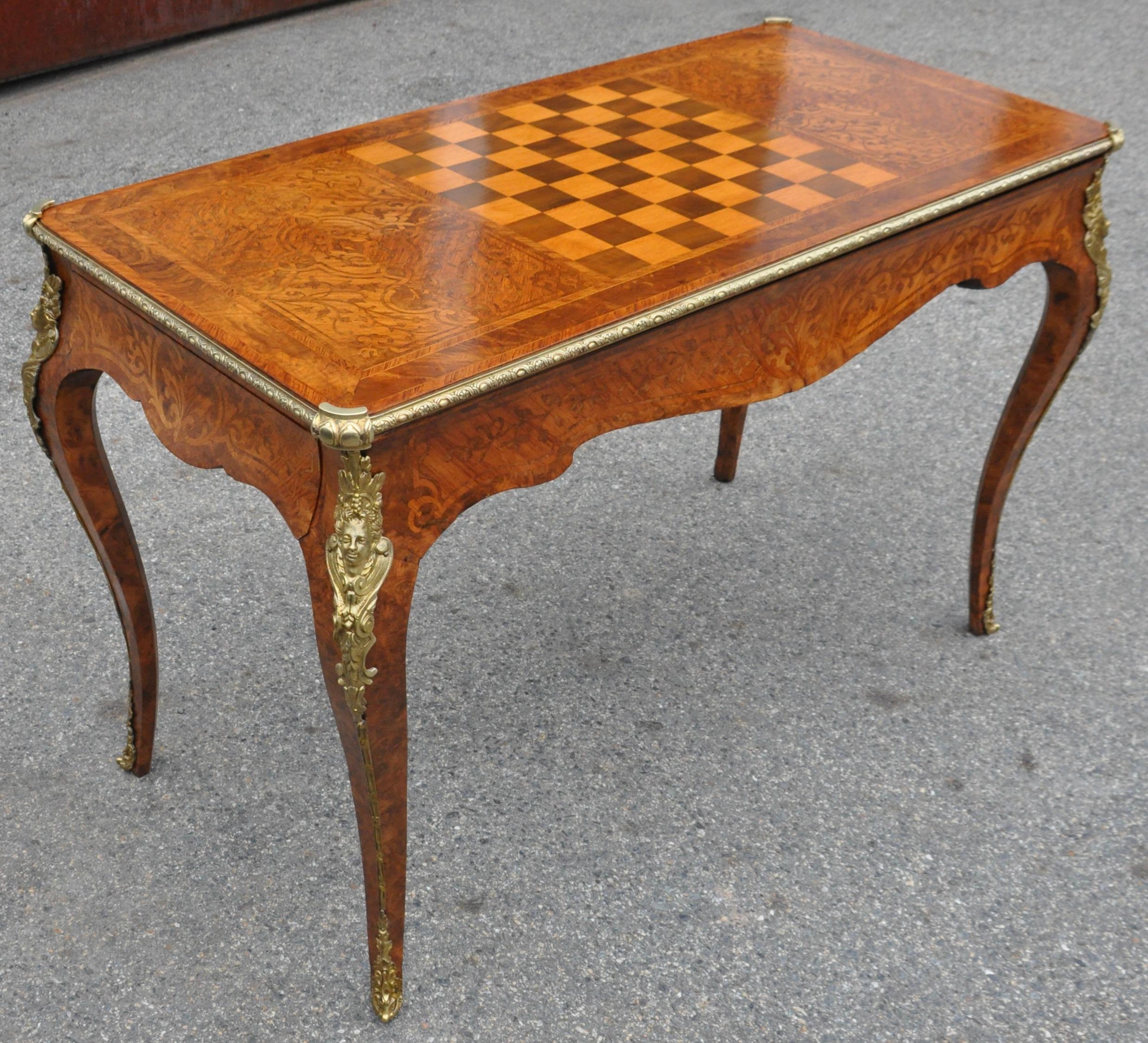 Fine 19th Century French Kingwood Regence Style Backgammon Games Table. Referred to as Tric-Trac. Kingwood and figured walnut marquetry inlay. Regence bronze mounts. Ebony with bone inlaid backgammon well. Candle cups. Bronze framed top with leather