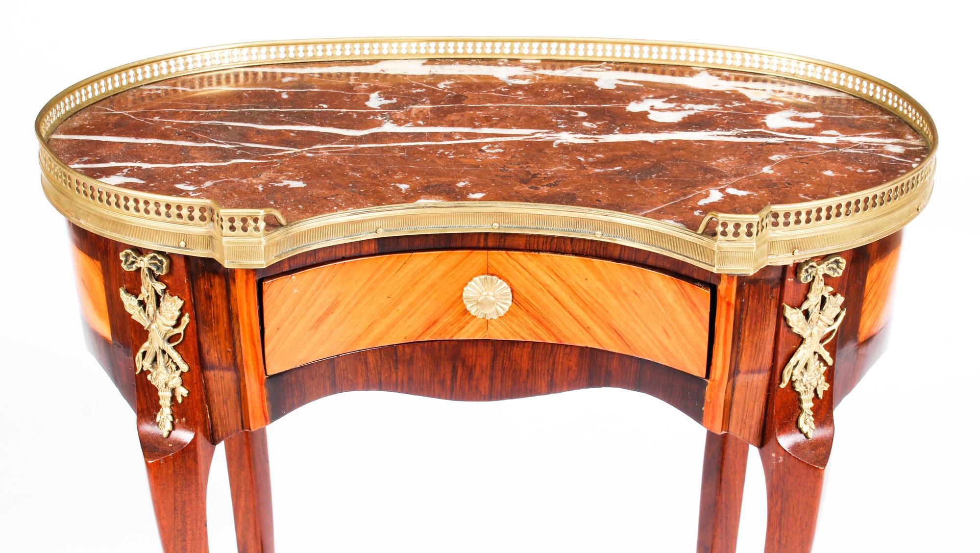 This is a splendid antique French kingwood and satinwood kidney-shaped side table with pierced gallery back above a marble top, circa 1860 in date.

This delightful side table has been masterfully crafted from beautiful kingwood and features a