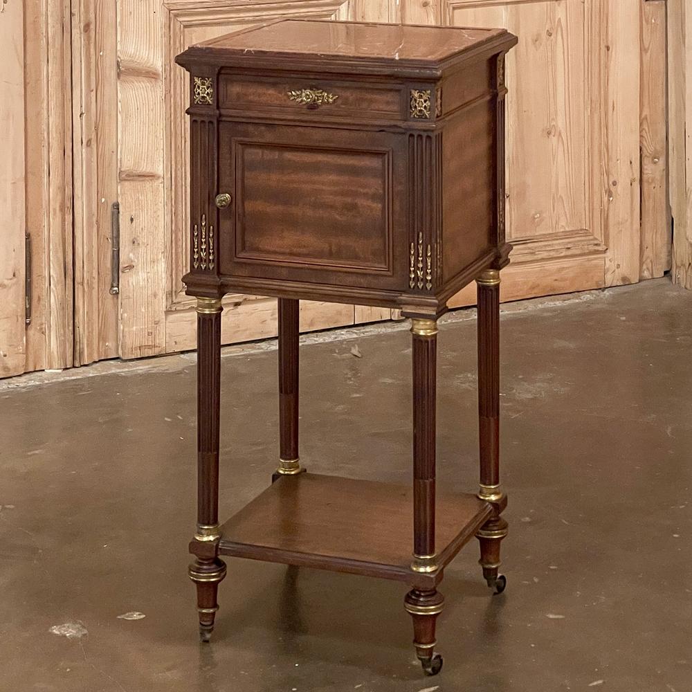 19th century French Krieger Louia XVI mahogany nightstand was crafted by some of the most talented hands ever to produce furniture the world over. The Krieger family was considered to be in the top five of Parisienne makers during the Belle Epoque,