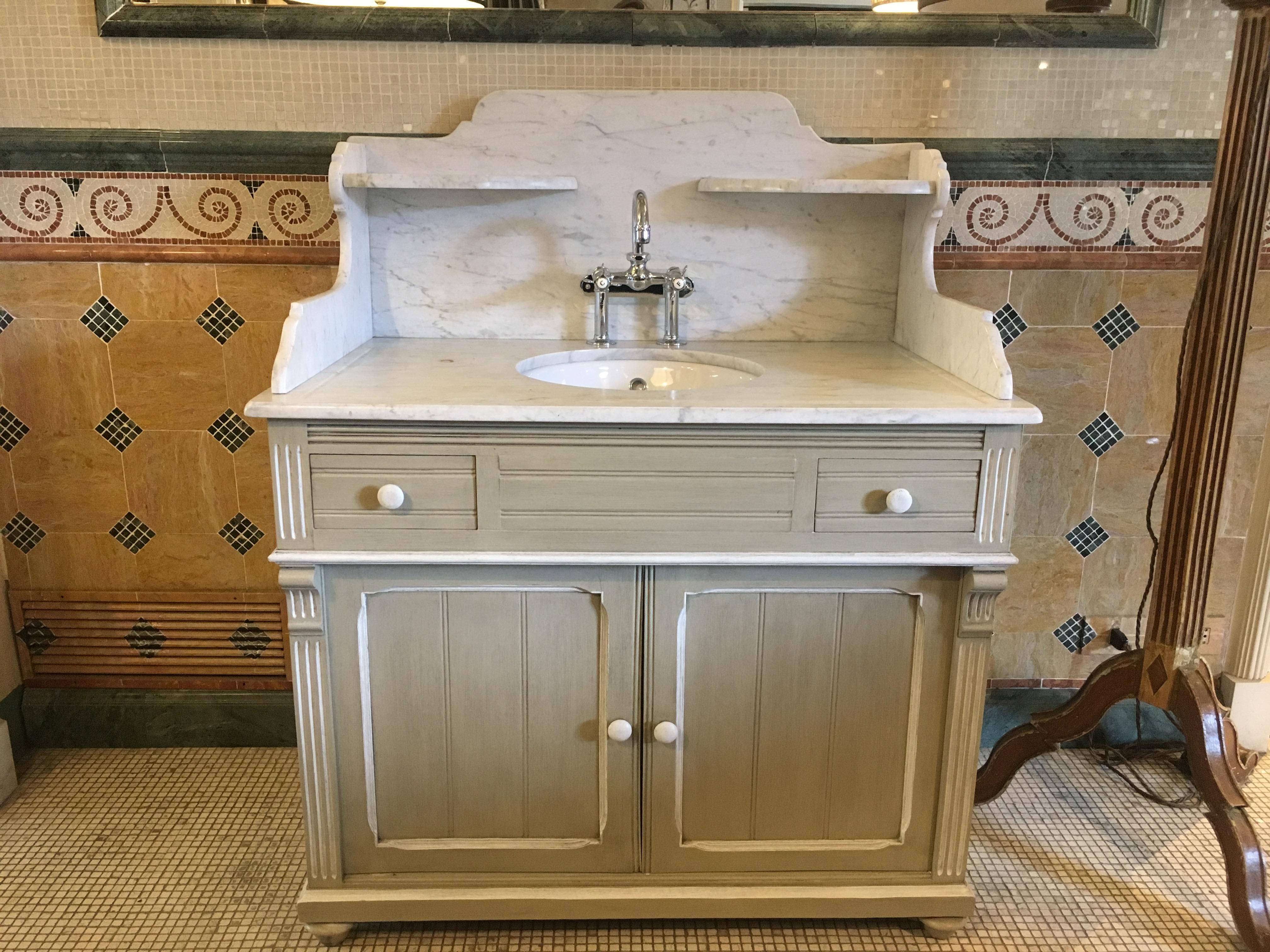 19th century French lacquered cupboard sink with Carrara marble top, 1890s.
This cupboard sink comes with its original restored nickel faucet.