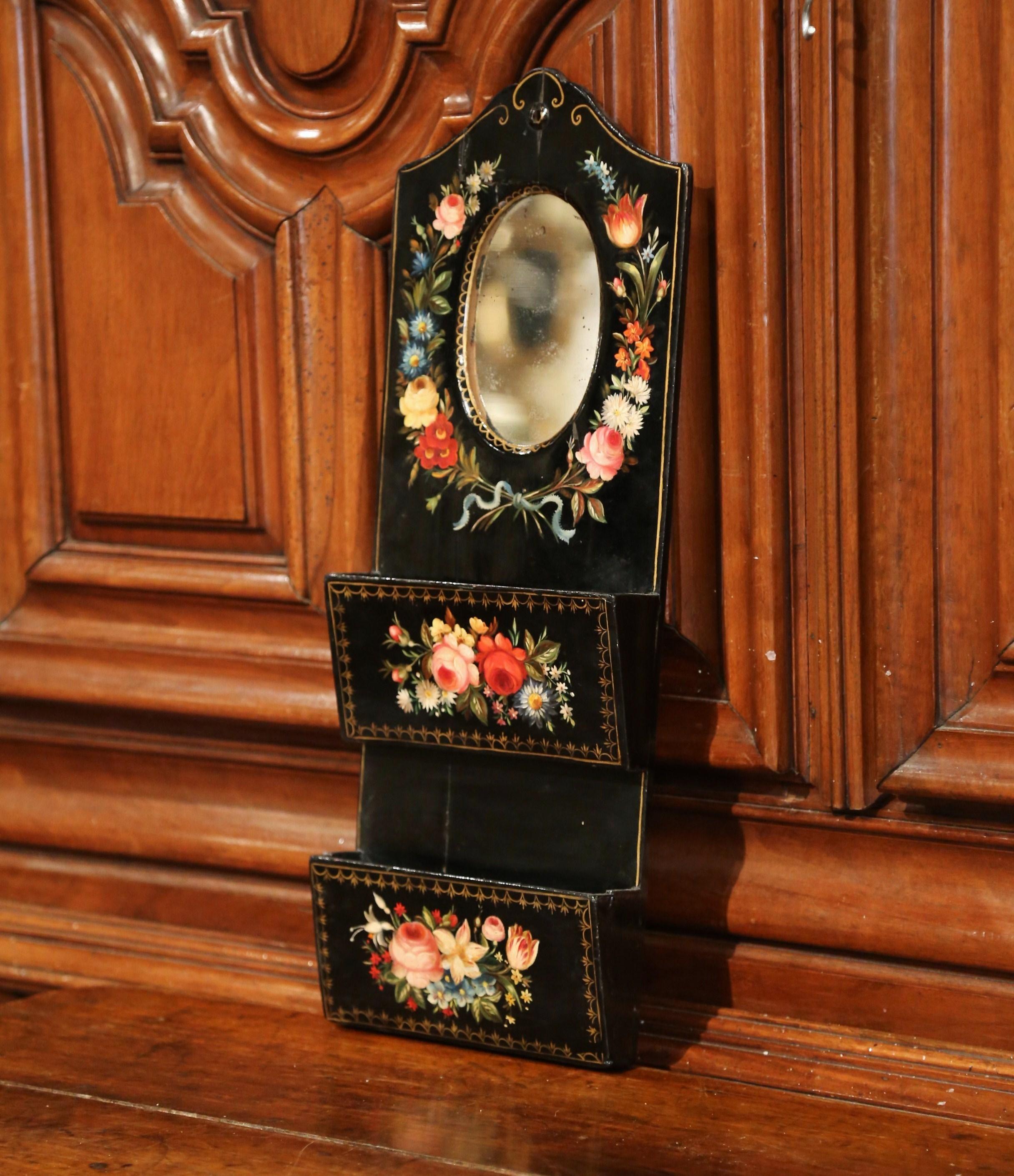 Keep your letters and notes in this charming Napoleon III wall hanging letter holder. Crafted in France, circa 1870, the wooden piece features an oval mirror with mercury glass, and double letter-slot compartments below. The letter holder is in