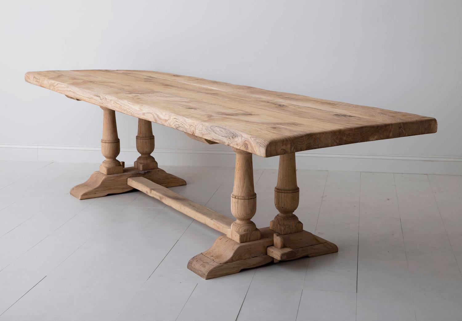 A grand-scale, sturdy French oak trestle dining table, circa 1880, with a soft, honey-colored bleached patina. This table came from a maison de maître (master's house) in Montpellier, France. It has a beautiful plank top that is 2.63 inches thick;