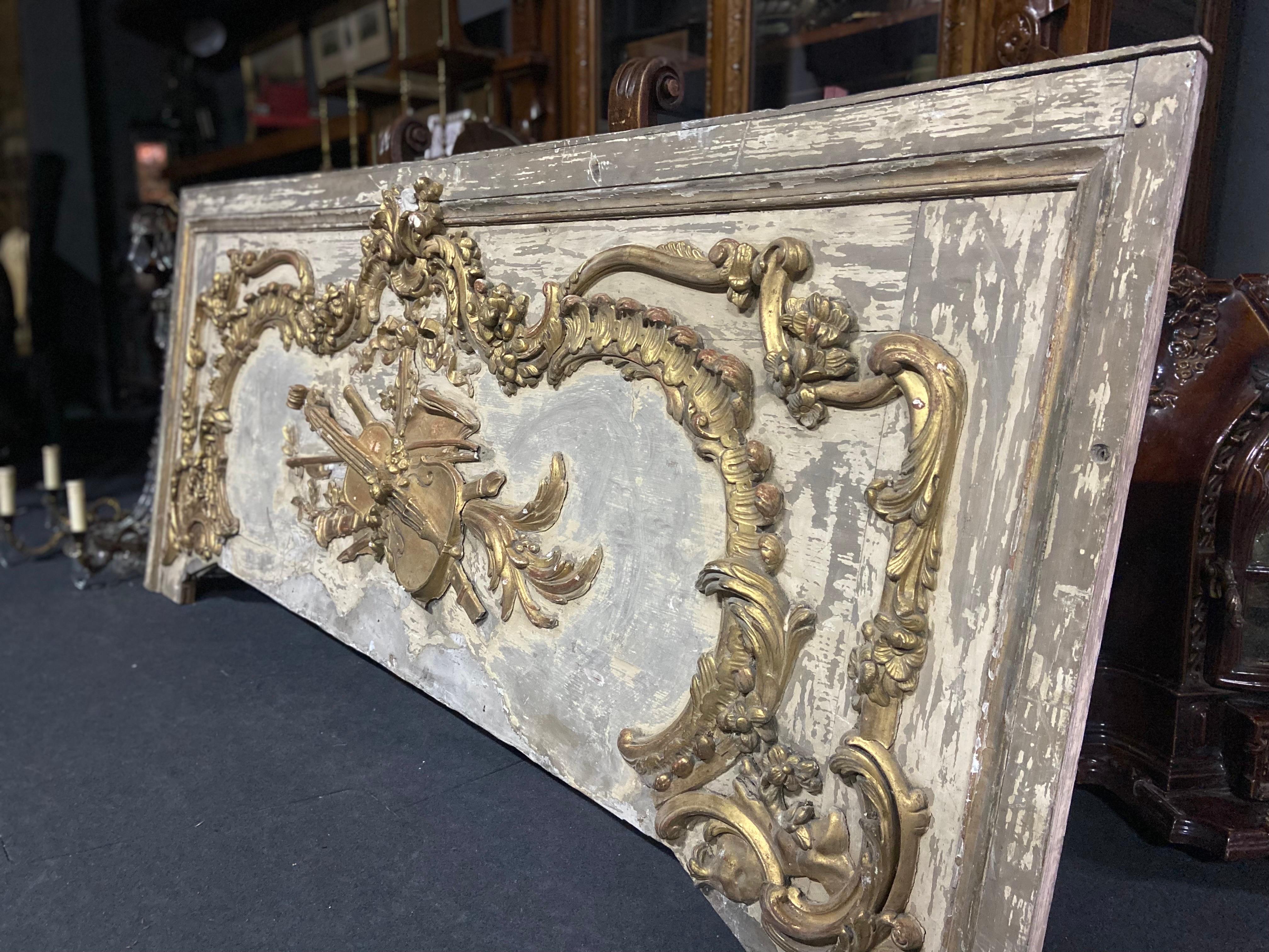 Exceptional large massive hand carved and hand painted decorative element which was placed over a grand fireplace more than 150 years ago. There were no restorations so far and it is absolutely authentic with fading in the colour and some cracks of