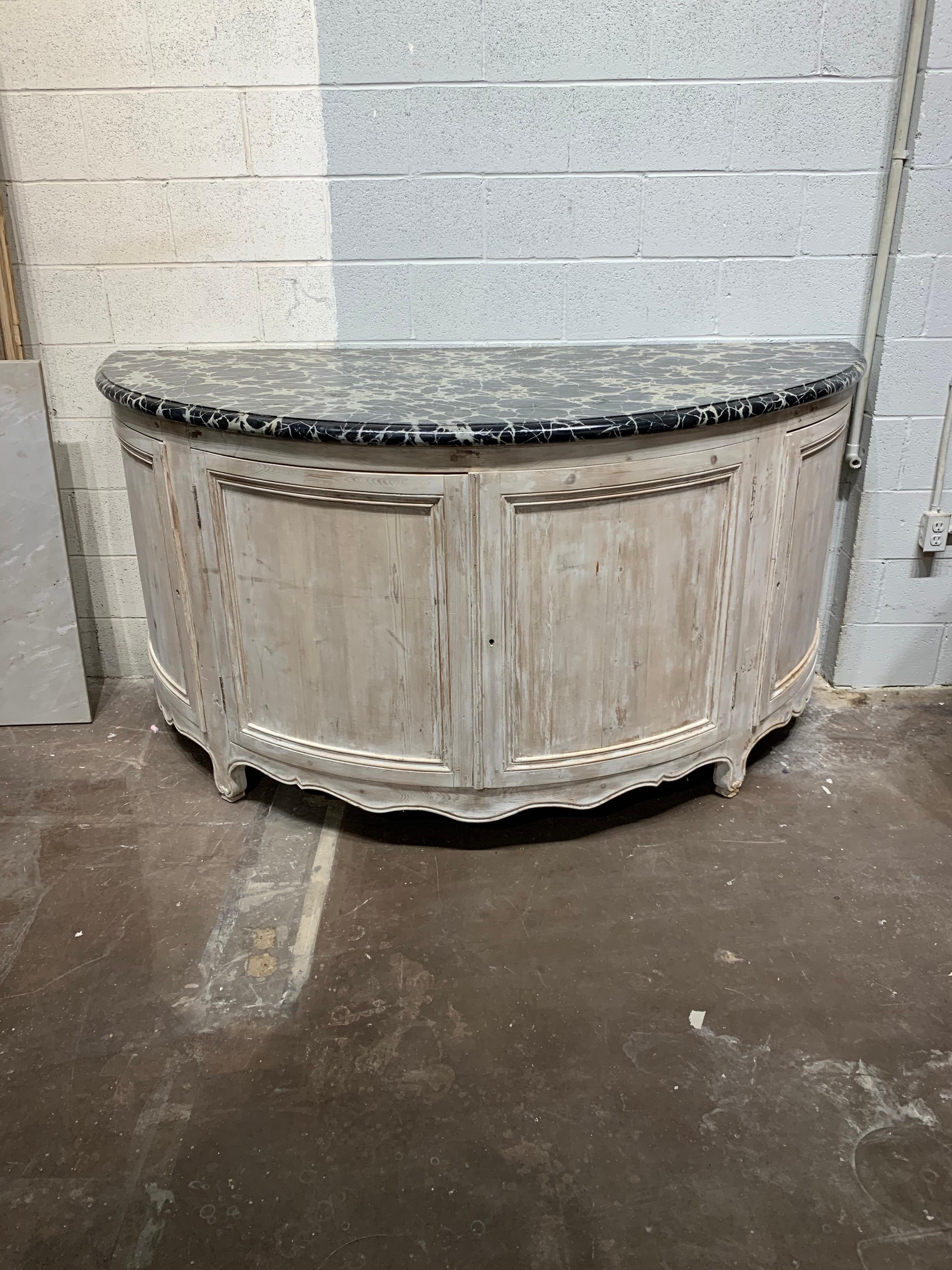 Interesting 19th century French large scale white-washed demi-lune console with faux marble top. Great patina and tons of storage. Nice!