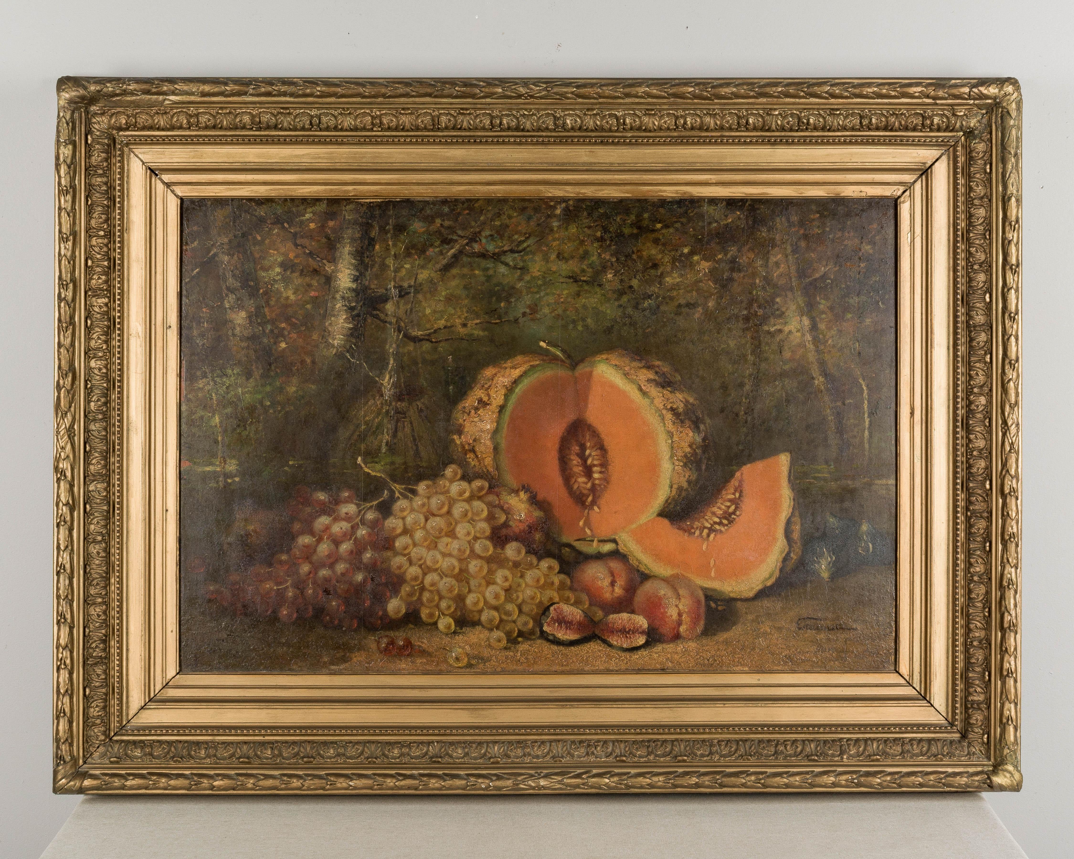 A large 19th century French still life with melons and Mediterranean fruits. Oil on a mahogany board. Signed lower right: Estournet. Heavy gilded wood and gesso frame. Circa 1890-1910
Dimensions: 50