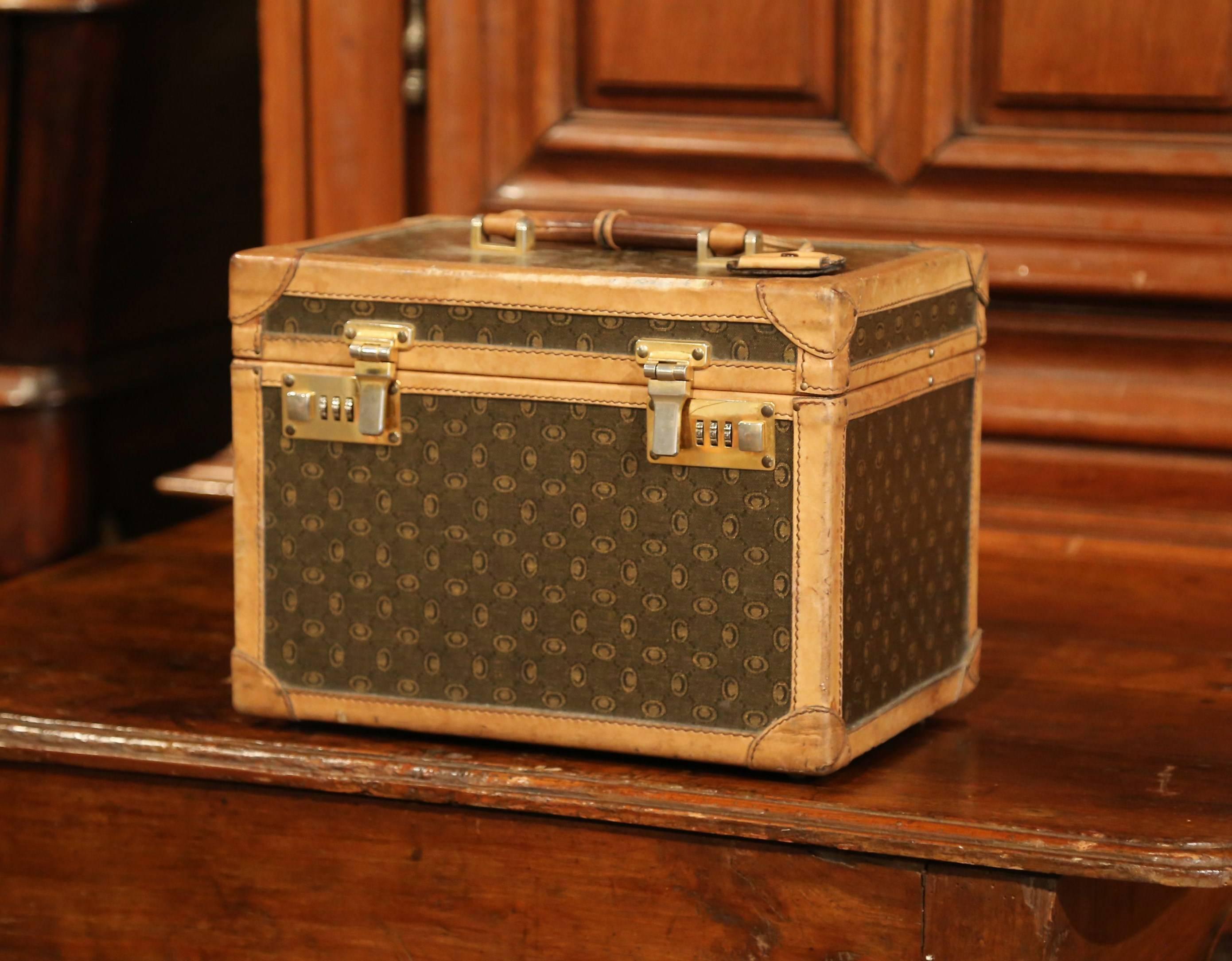 Stow your toiletry and other treasures inside this elegant, antique traveling box. Crafted in France, circa 1880, this decorative trunk is covered with leather panels embellished by painted accent decor, leather trim and studded with brass hardware.