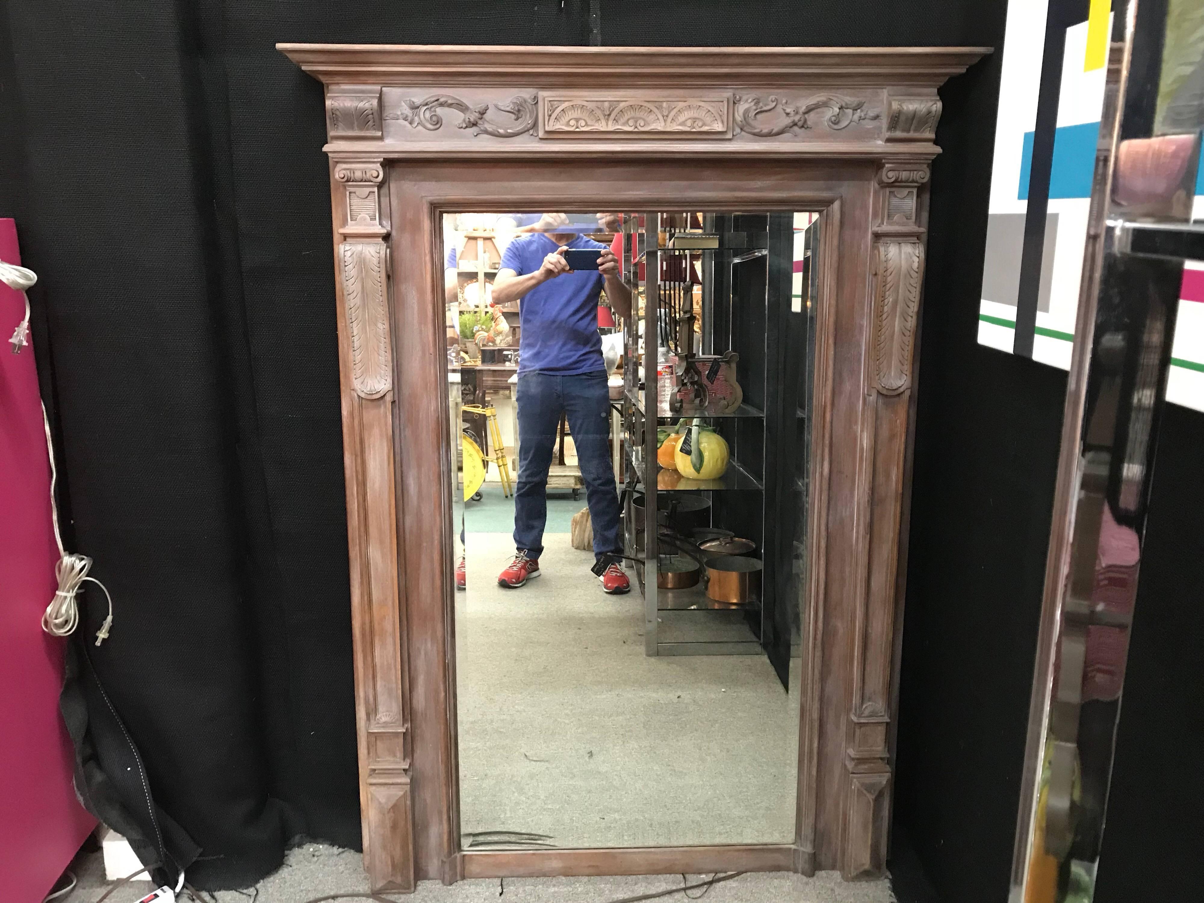 19th century, French limed wood Neoclassical style beveled mirror.
Stunning 19th century French limed wood or cerused wood full length Neoclassical style beveled mirror.
This versatile antique French mirror would work well above a fireplace,