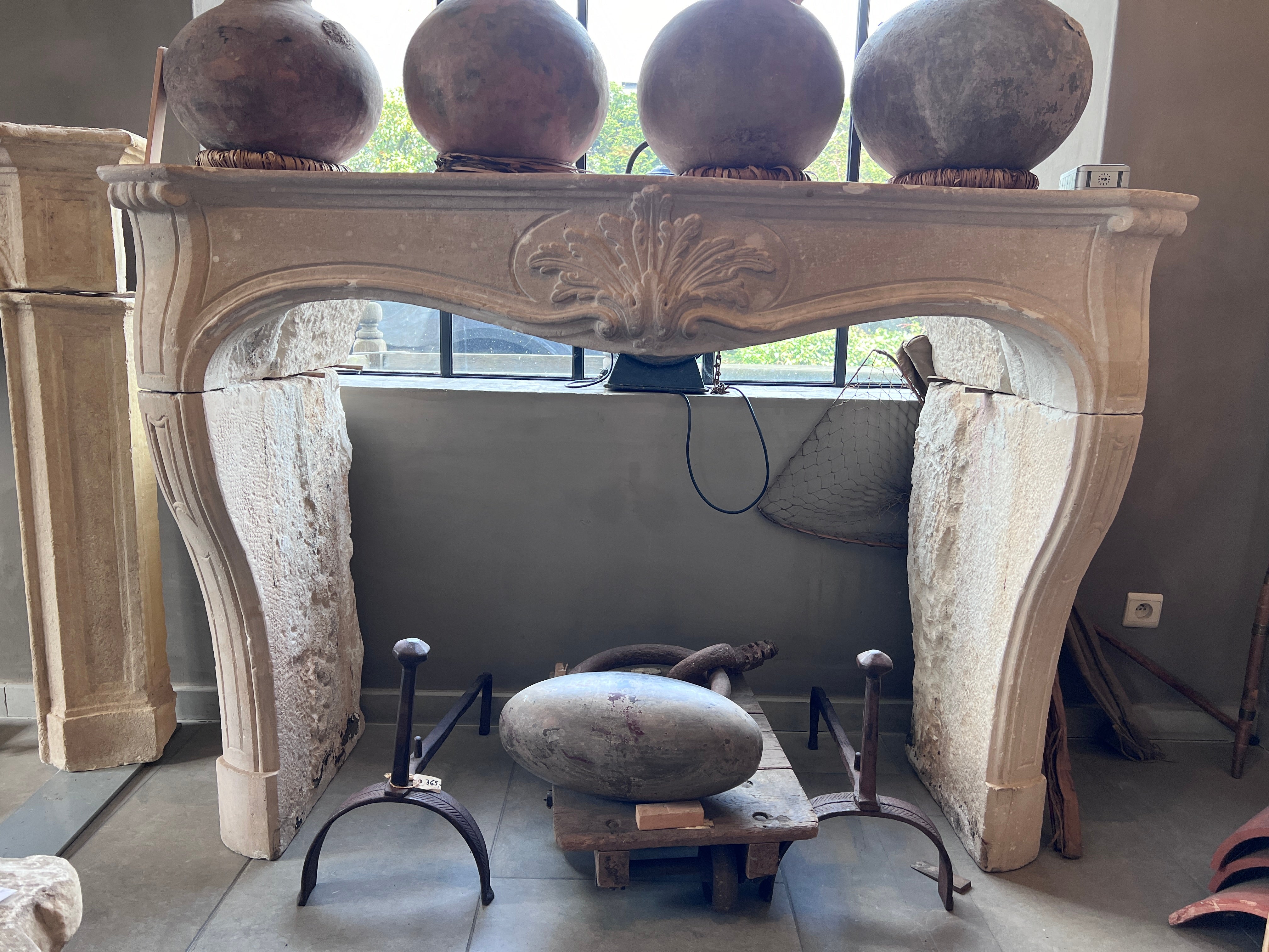 19th Century French Limestone Louis XV Fireplace Mantel For Sale