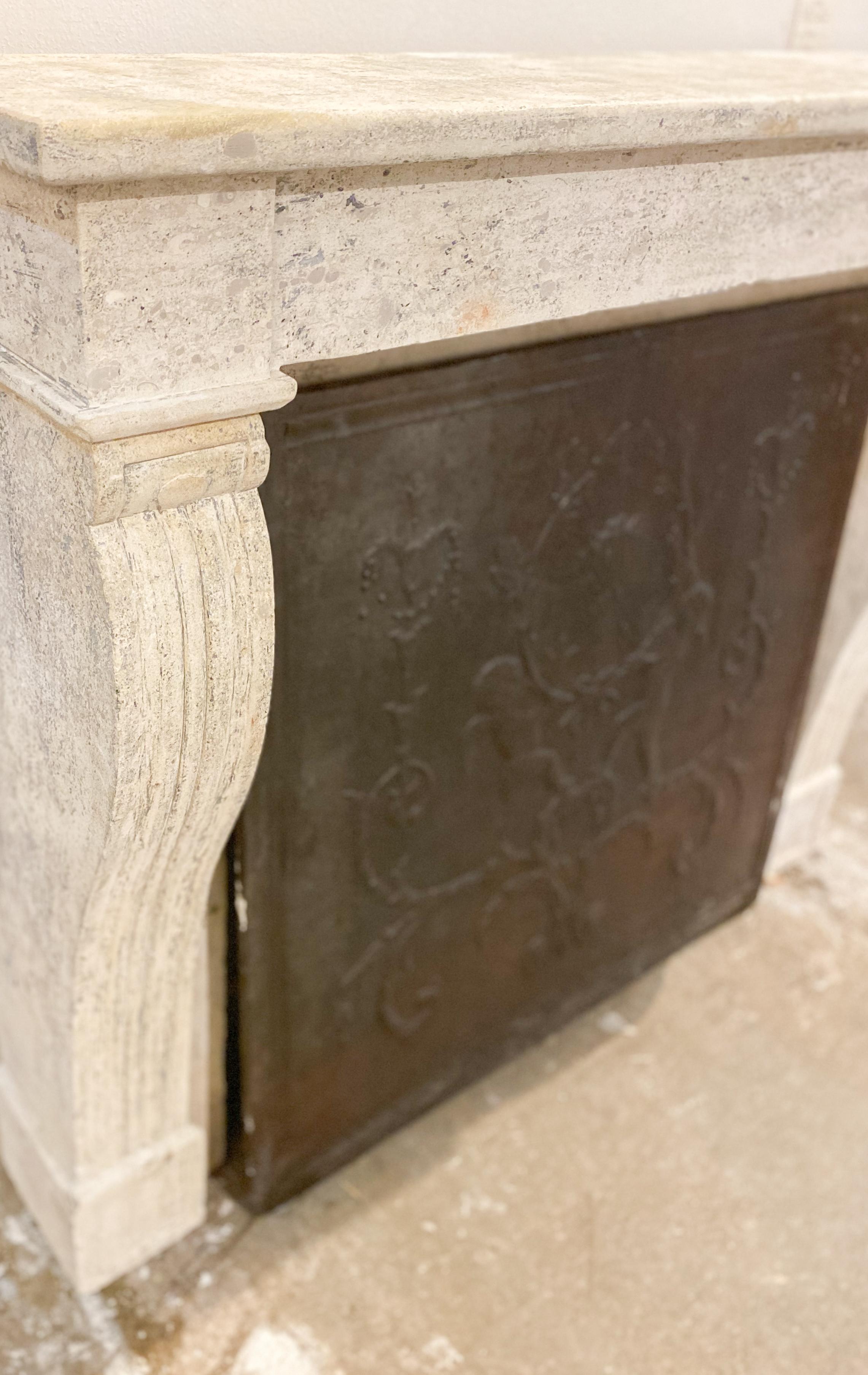 This limestone mantel dates back to 1800 and features an eviable natural patina. 

Measurements: 51” W x 13” D x 44” H
Firebox: 40” W x 38” H.