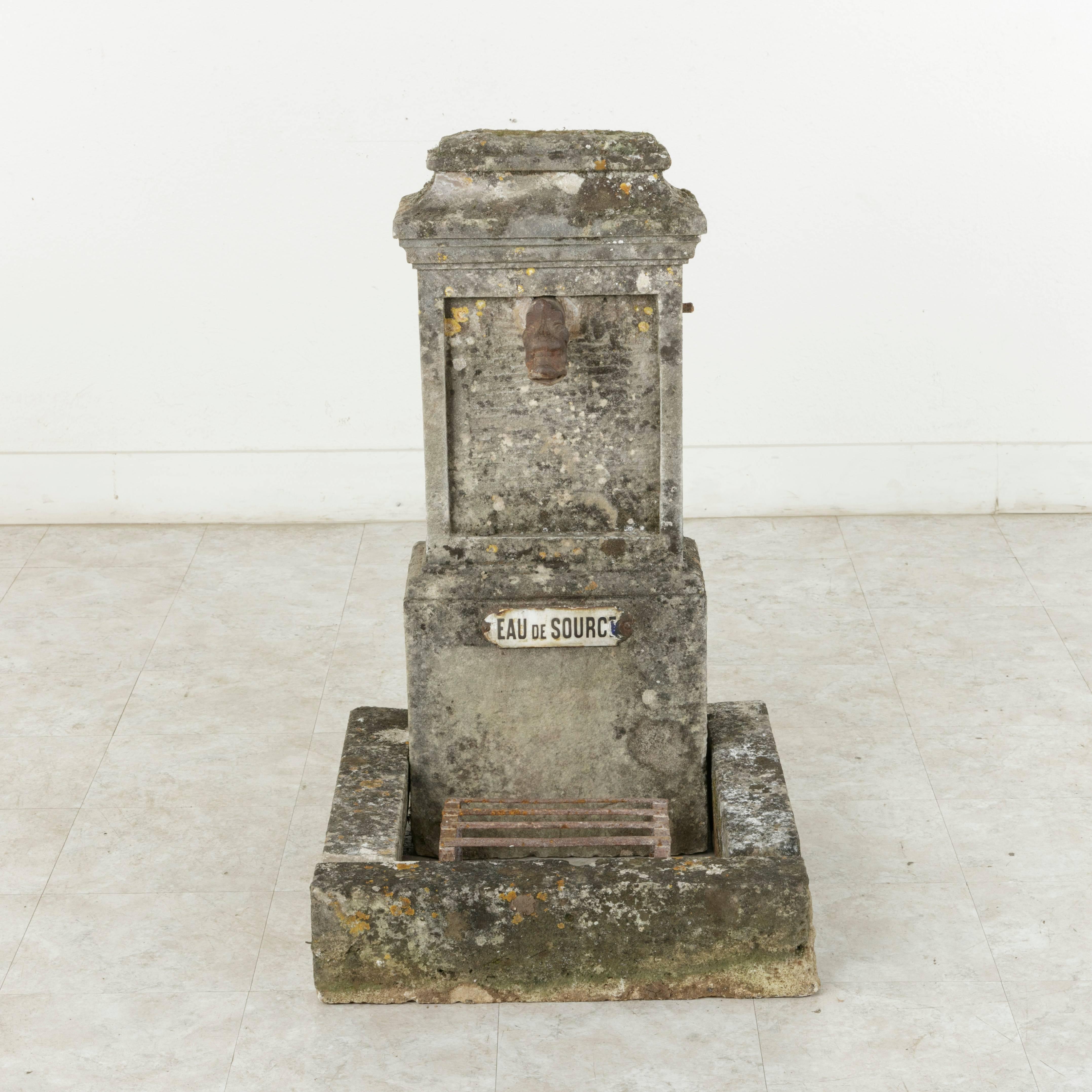 Originally from the village of Senlis in Northern France, this beautifully aged 19th century stone fountain was once used by the local residents to draw water from. Made from hand-cut limestone, it boasts its original iron spout in the form of a