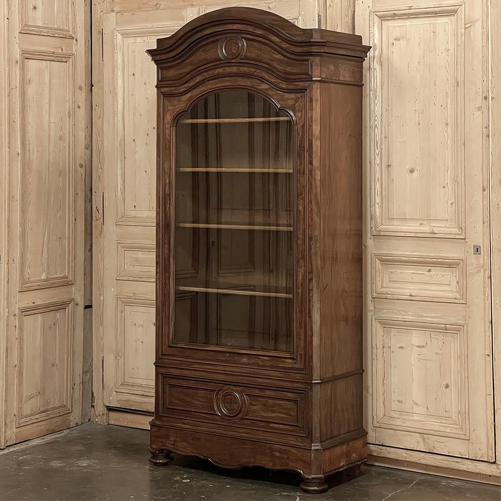 19th Century French Louis Philippe Bookcase ~ Display Armoire features a tailored architecture that allows it to blend with a wide variety of styles and decors!  The classic arched bonnet is crowned with bold molding detail, and features a circular