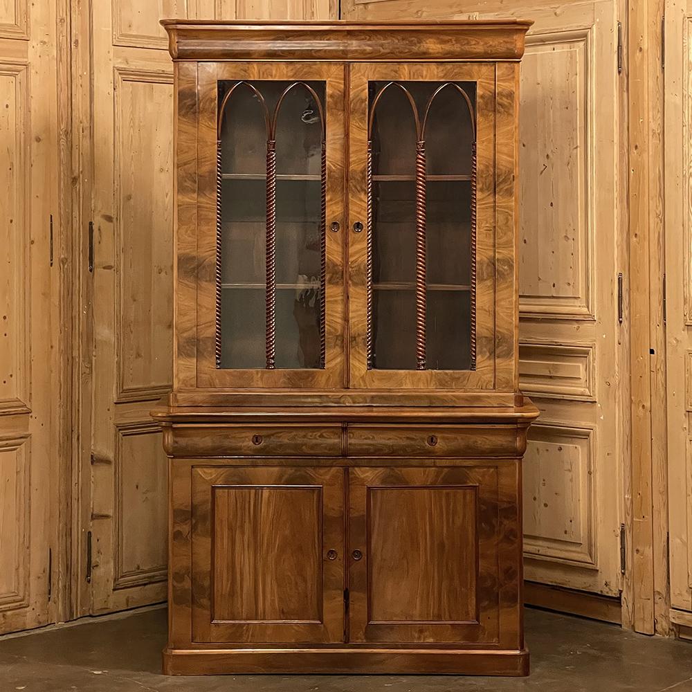 19th Century French Louis Philippe bookcase in Flame Mahogany is a superlative example of the genre, noted for its tailored lines and lack of carved embellishment, which endears itself to almost any decor! This example, rendered from exotic imported