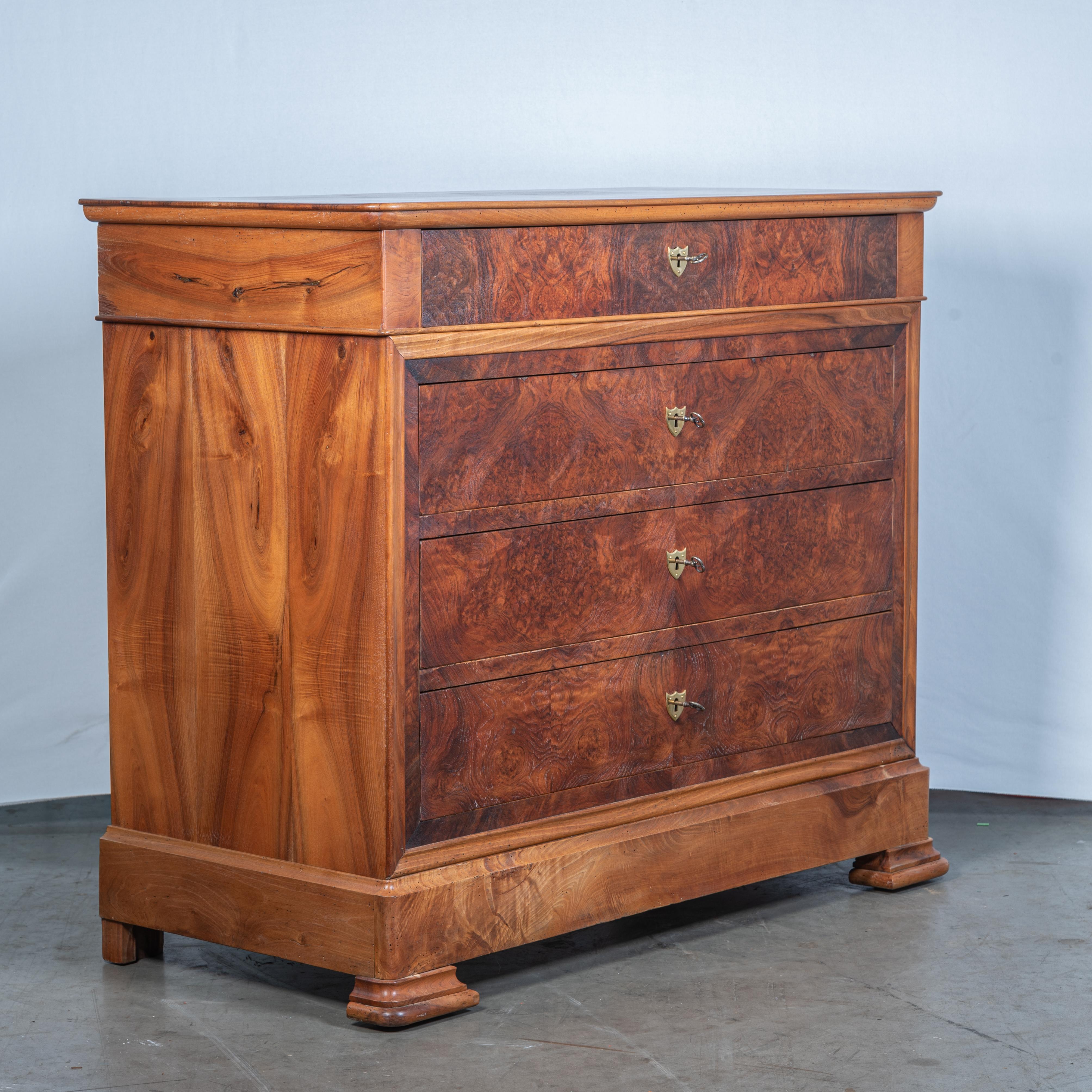 The 19th Century French Louis Philippe Burl Walnut Commode is a stunning testament to the exquisite craftsmanship and refined taste of the Louis Philippe era.

King Louis Philippe, who reigned from 1830 to 1848, was known for his understated yet