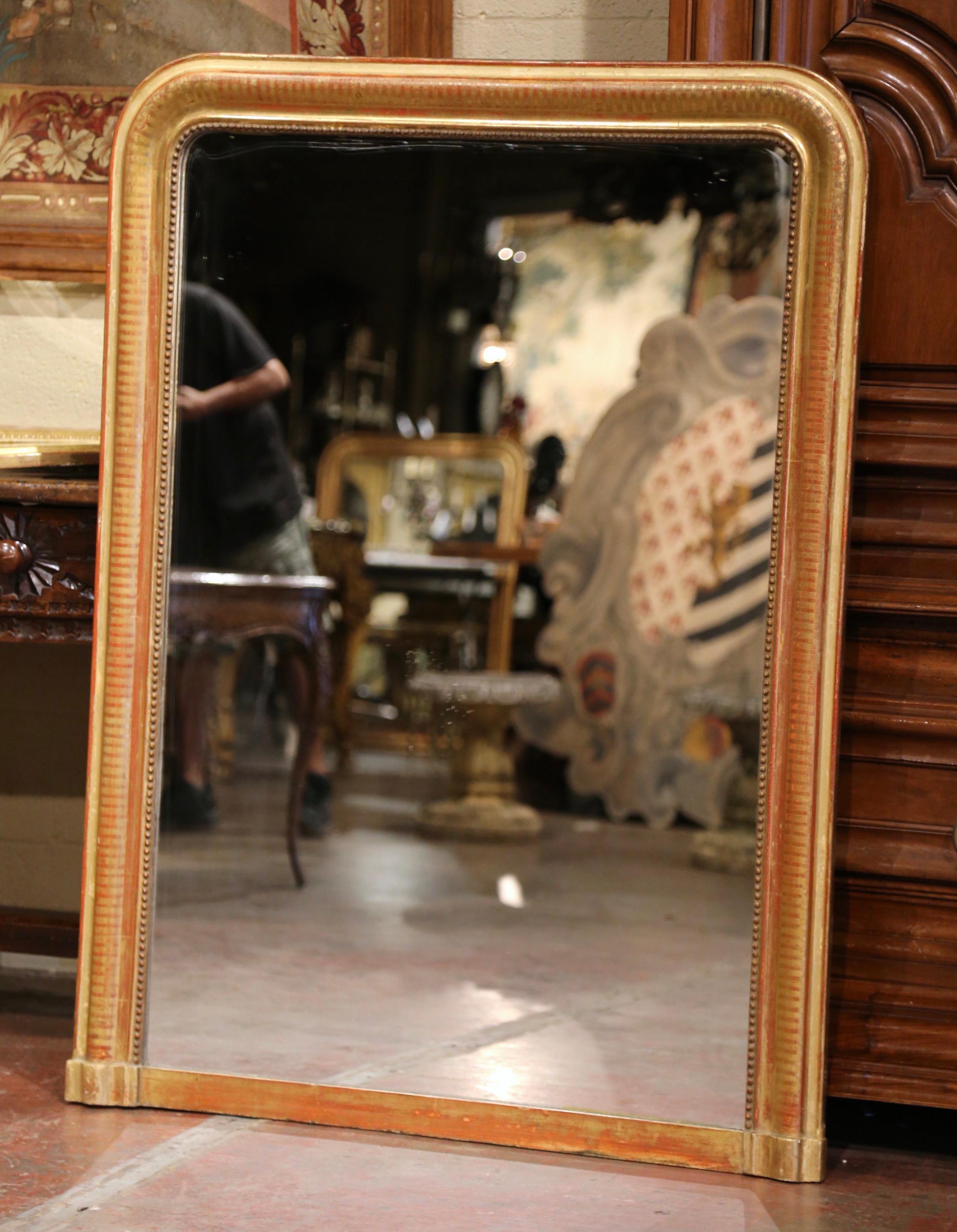 Dress a mantel with this elegant antique Louis Philippe style mirror. Crafted in the Burgundy region of France, circa 1860, the large wall mirror has traditional, timeless lines with rounded corners and a straight base bottom. The elegant frame is