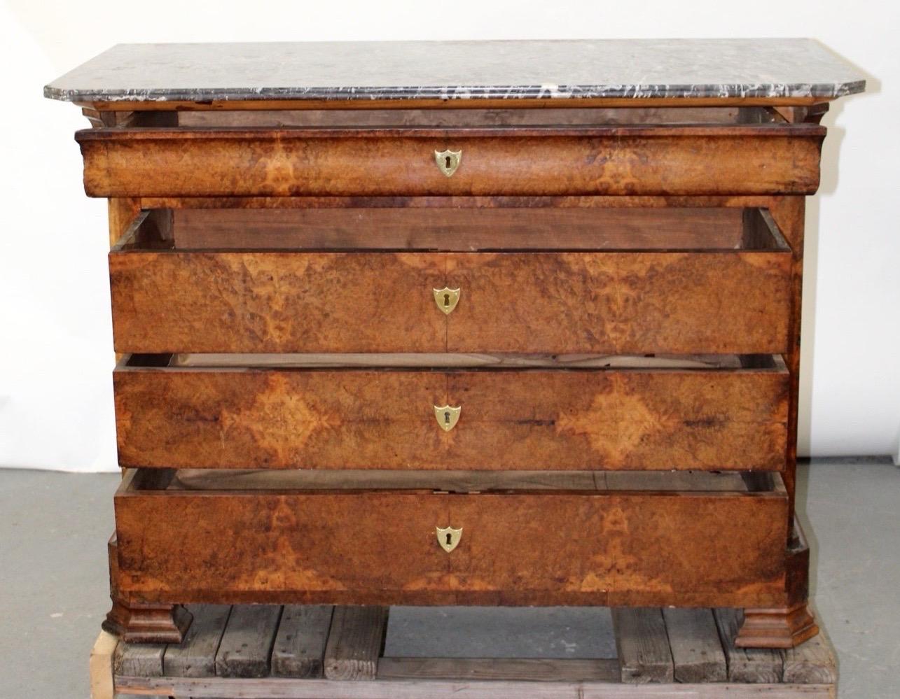 19th-century French Louis Philippe commode in burled walnut with original marble top. No locks are present. Newer Brass Escutcheons.


39