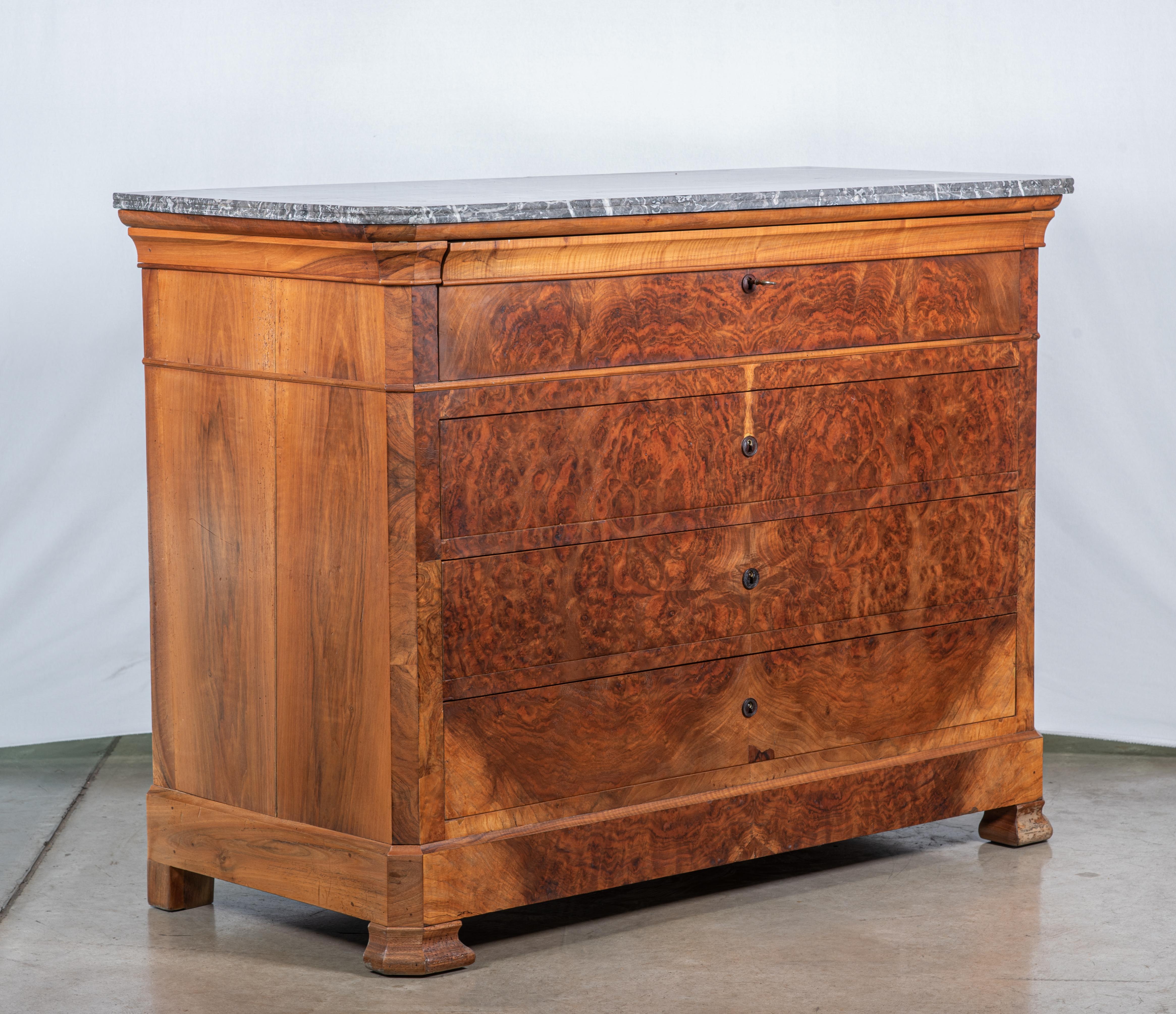 Indulge in the timeless elegance of our 19th Century French Louis Philippe Commode Secretary, meticulously crafted from walnut veneer and adorned with exquisite burl wood detailing at the top desk portion. This magnificent piece seamlessly combines