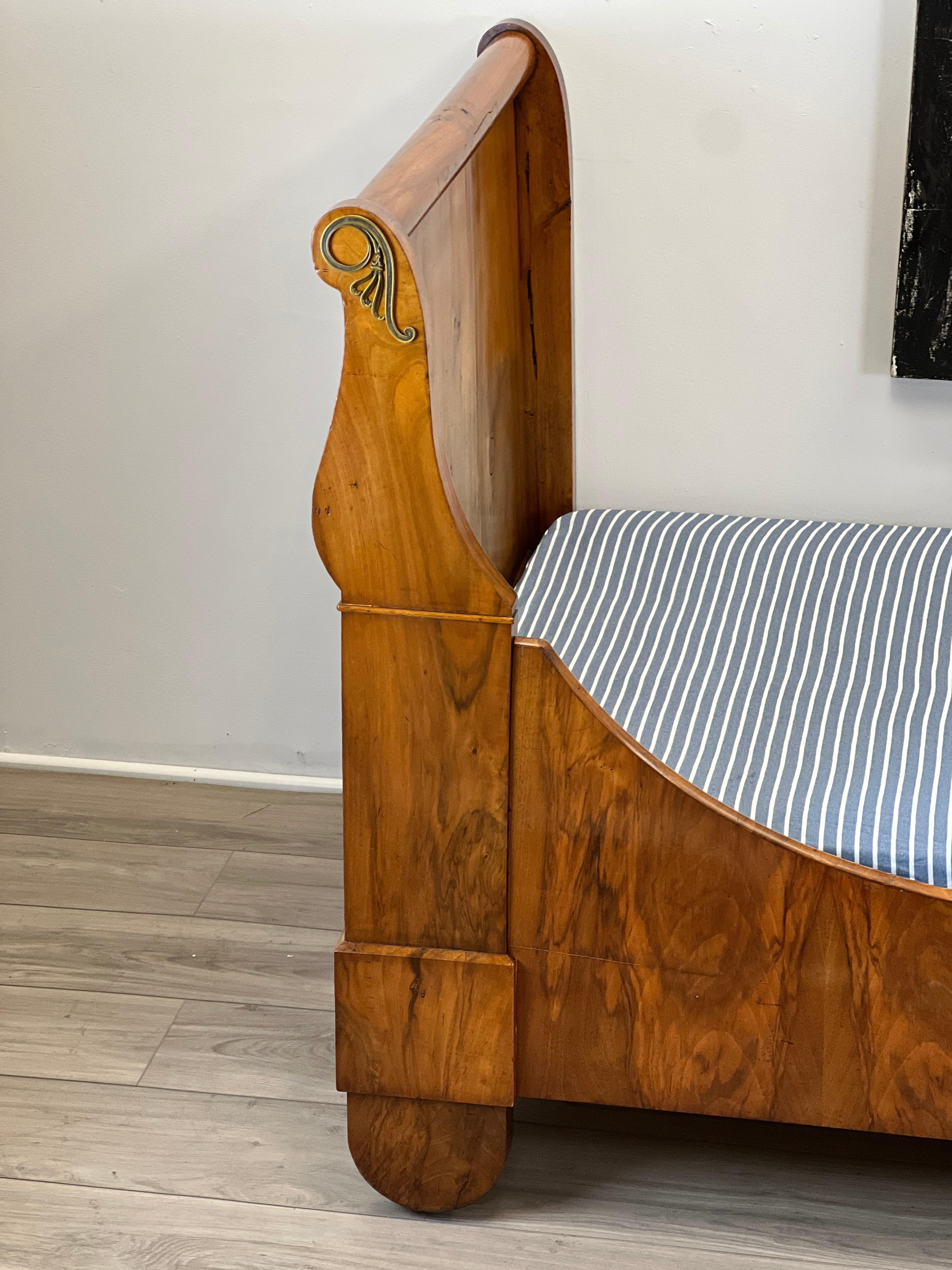 Featured is a very handsome Period French Louis Philippe daybed constructed of walnut. The bed consists of seven total parts. A head and foot end, two side rails, a bottom mattress support board and two bed slats. Also the bed frame will come with