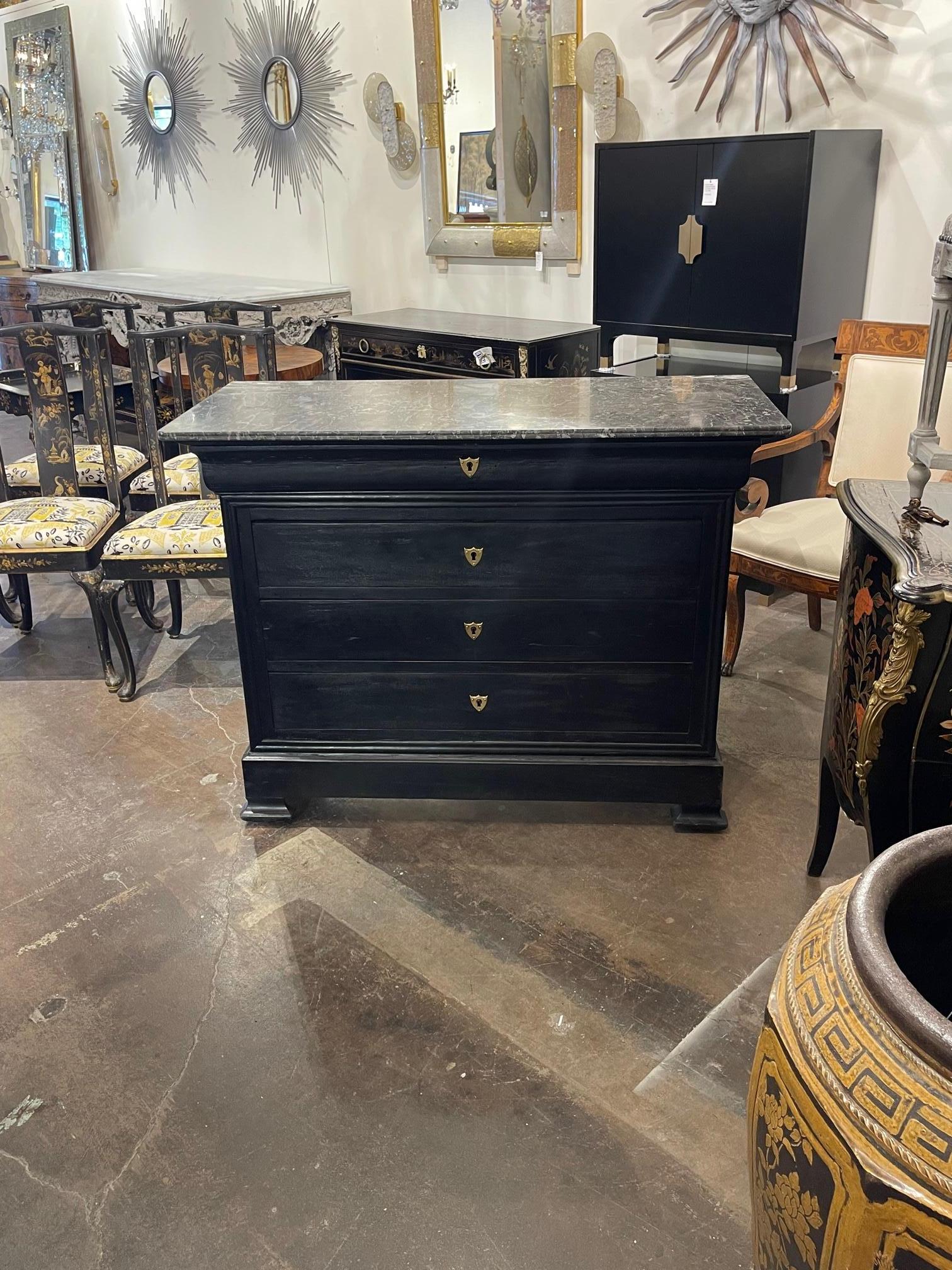 Gorgeous 19th century French Louis Philippe ebonized chest with a grey marble top. The piece has 4 drawers for storage as well. Lovely clean lines. So pretty!!