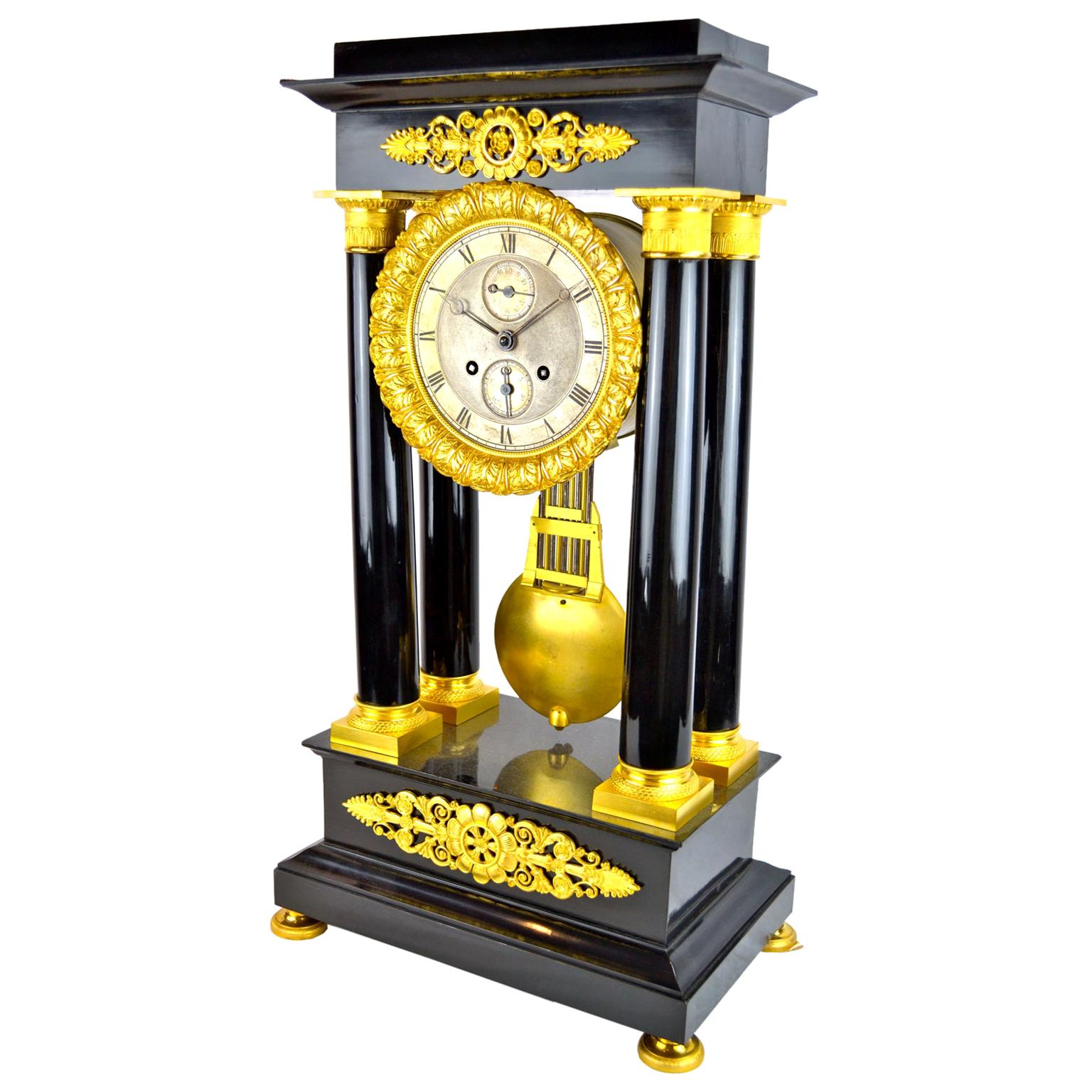 19th Century French Louis Philippe Ebonized Wood and Gilt Bronze Portico Clock For Sale