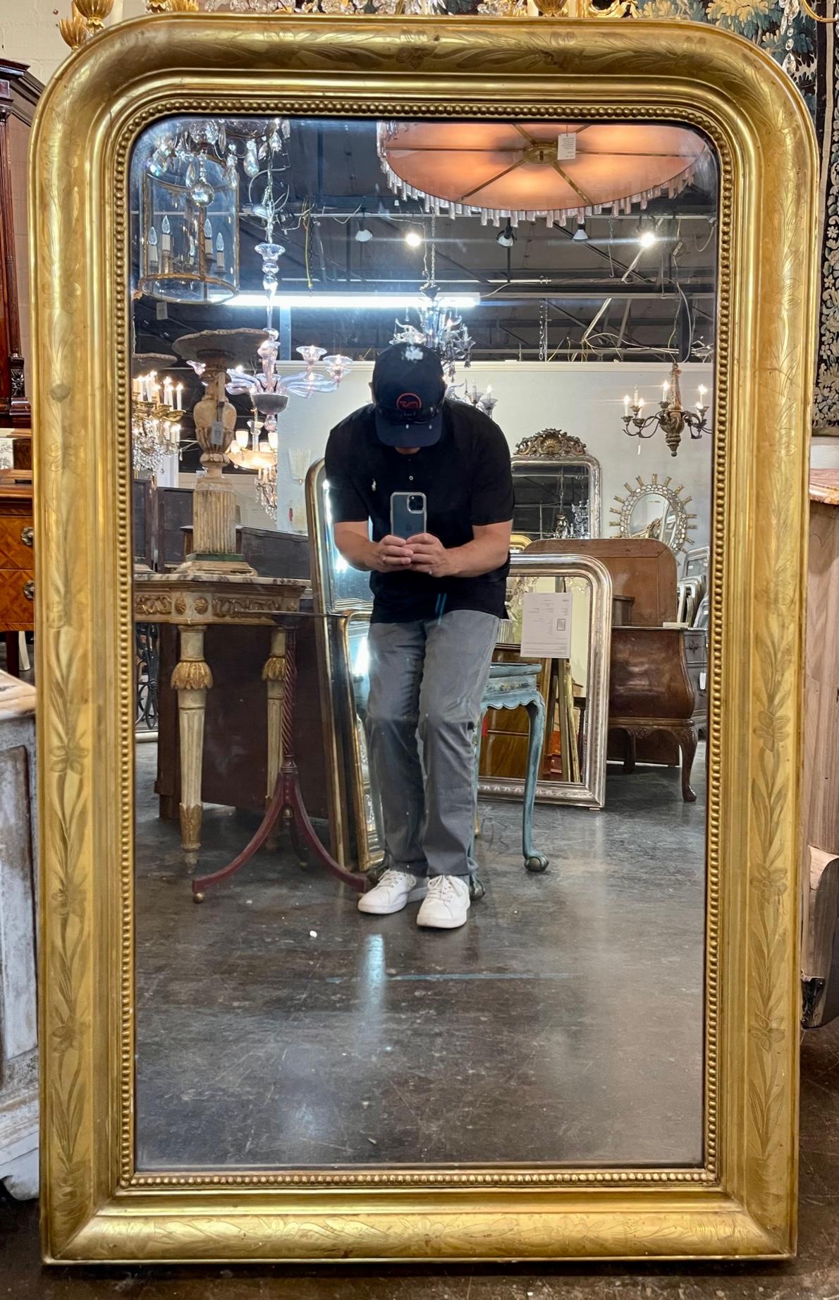 19th century French Louis Philippe gold leaf mirror with floral pattern. Circa 1870. This has the original mercury glass. A fine addition to any space.