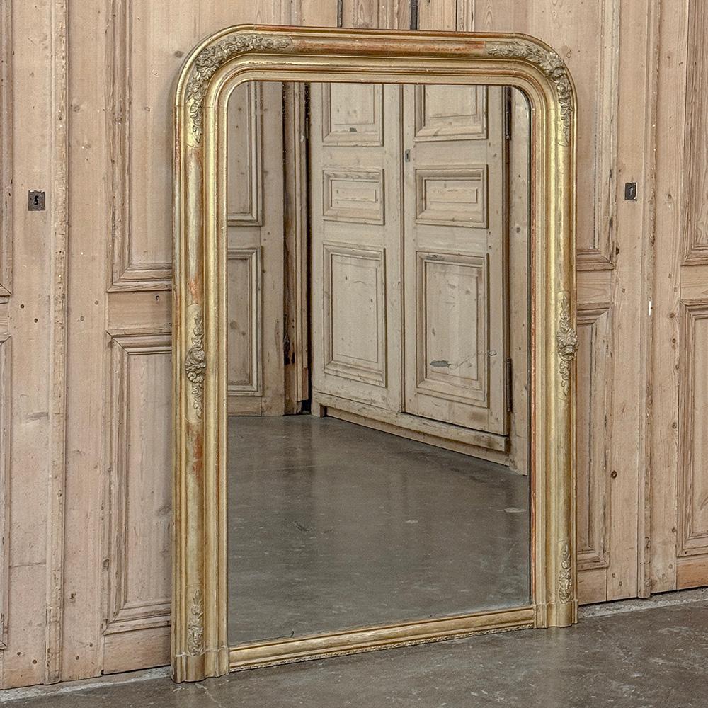 19th Century French Louis Philippe Gilded Mantel Mirror features a flair in detail that began to appear at the end of the period towards the beginnings of what today is called the Napoleon III period.  Although the architecture is the same as we see
