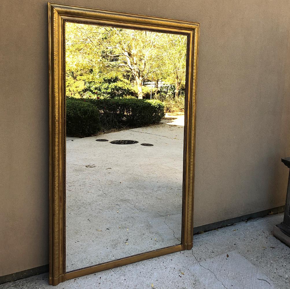 19th century French Louis Philippe gilded mirror is a wonderful example of the genre, with subtle embossed pattern showing through the original gold leaf finish all set in a very elegant yet tailored design that is a hallmark of the period. Such