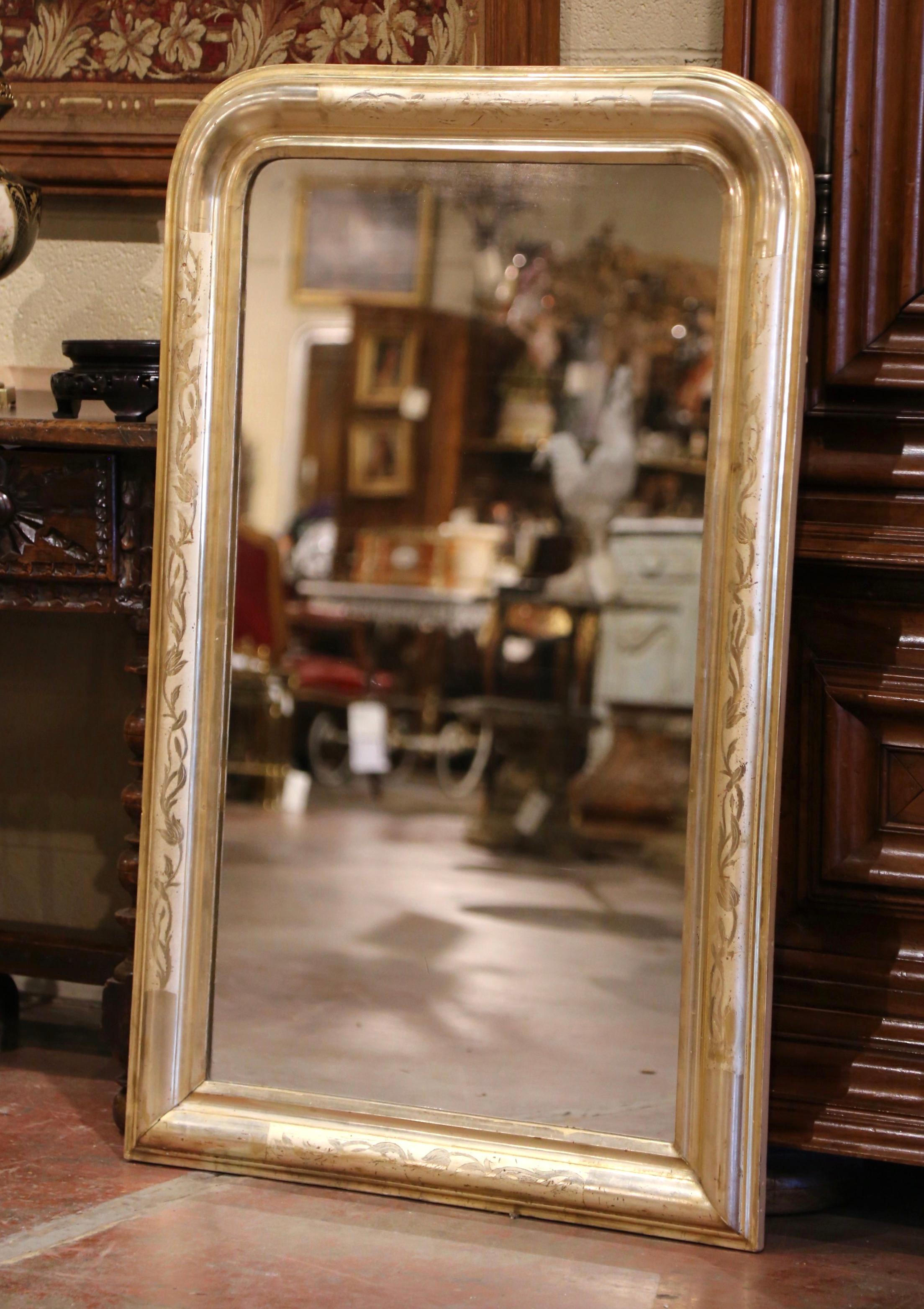 Decorate an entry with this elegant antique gilt mirror. Crafted in the Burgundy region of France, circa 1870, the rectangular mirror has traditional, timeless lines with rounded corners. The frame is decorated with a luxurious gold leaf finish over
