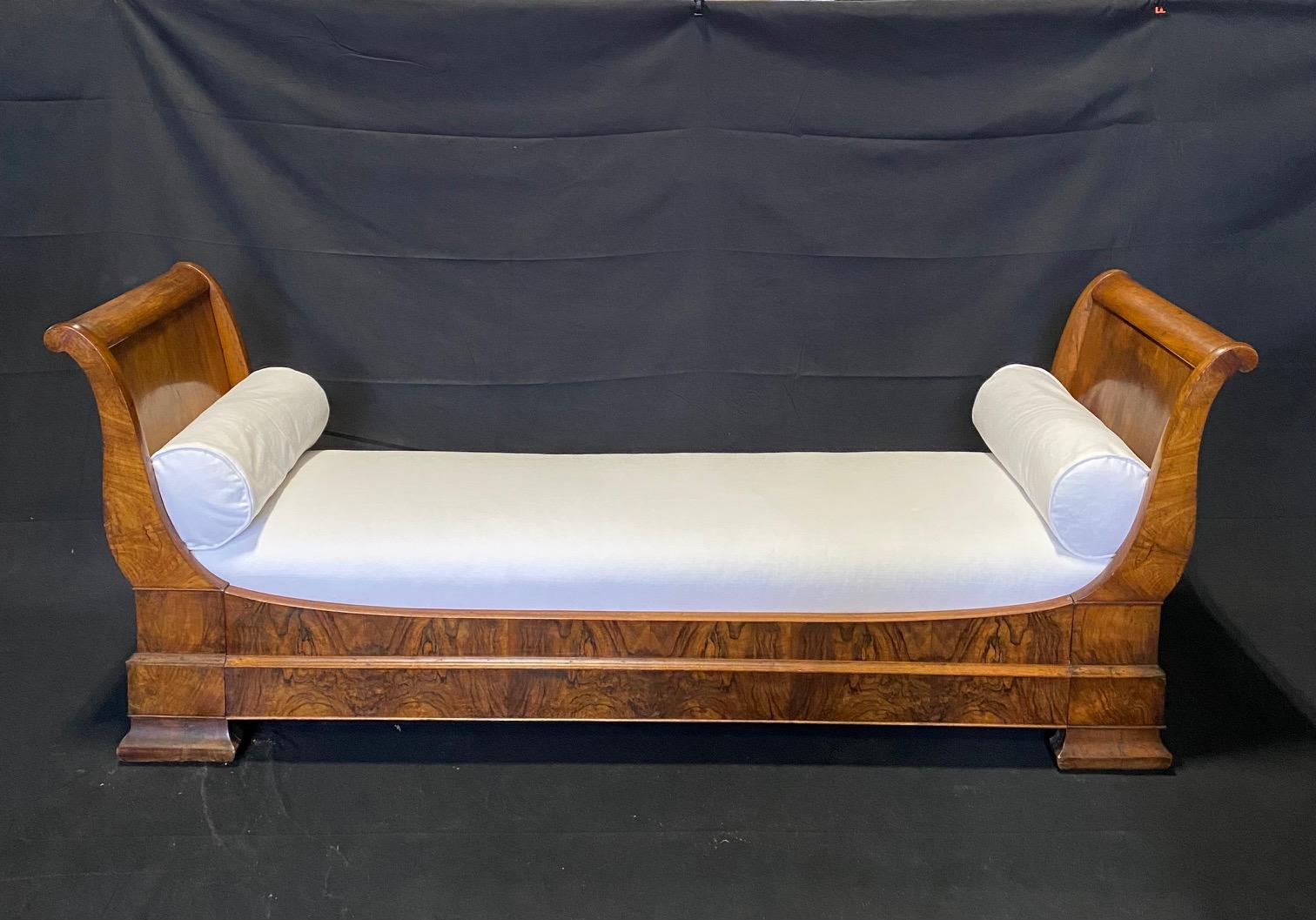 A Louis Philippe style beautifully burled walnut daybed. Mid-19th century, France. Newly upholstered and reconditioned. #5624.