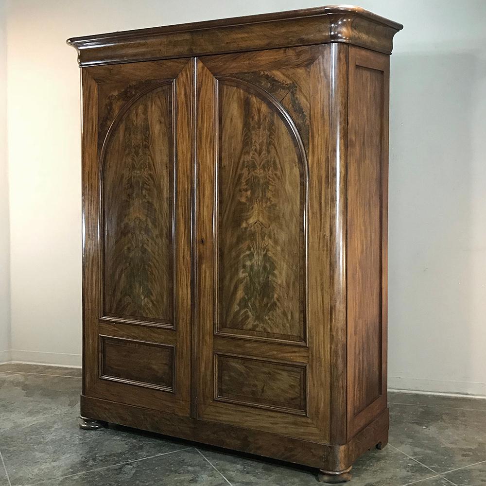19th century French Louis Philippe period burl mahogany armoire with commode inside is a marvel of craftsmanship, utilizing exotic imported woods from the Americas to create pieces that are destined to last for centuries! This example, with its